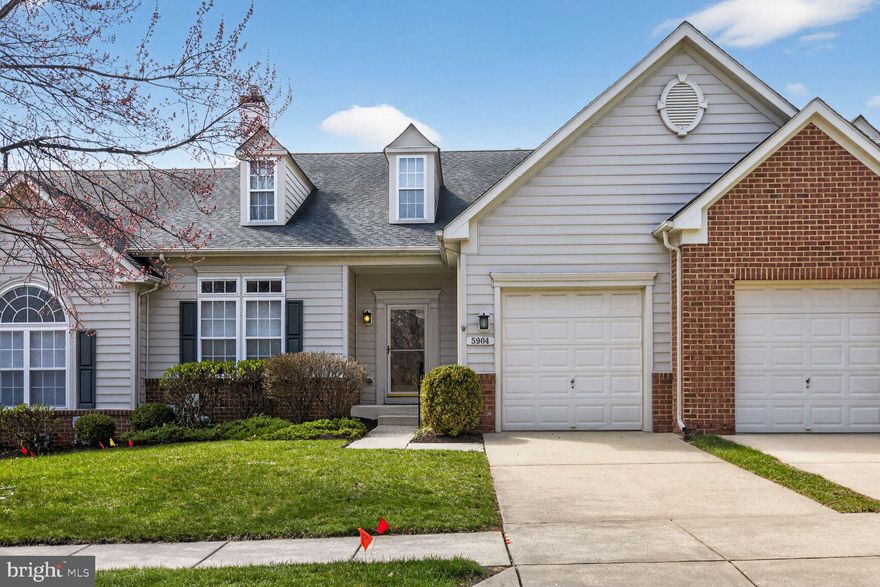 Welcome to this beautifully maintained 55+ villa in the sought-after Hearthstone community, where comfort and convenience meet. The open-concept main level features soaring vaulted ceilings, rich wood floors, and a striking three-sided gas fireplace shared by the living and dining areas, creating a warm and inviting atmosphere.

The chef’s kitchen offers 42” cabinets, granite countertops,—perfect for everyday living and entertaining. The main-level owner’s suite provides a peaceful retreat with a walk-in closet and a spa-like bath with an oversized shower.

Upstairs, a spacious loft offers flexible space for a home office or guest area, while the finished lower level includes a large recreation room with a rough-in for a future bath and room to expand. Enjoy the outdoors on the maintenance-free deck with a retractable awning.

Set in a quiet, park-like community just minutes from shopping and dining, this move-in-ready home offers easy, low-maintenance living at its best!