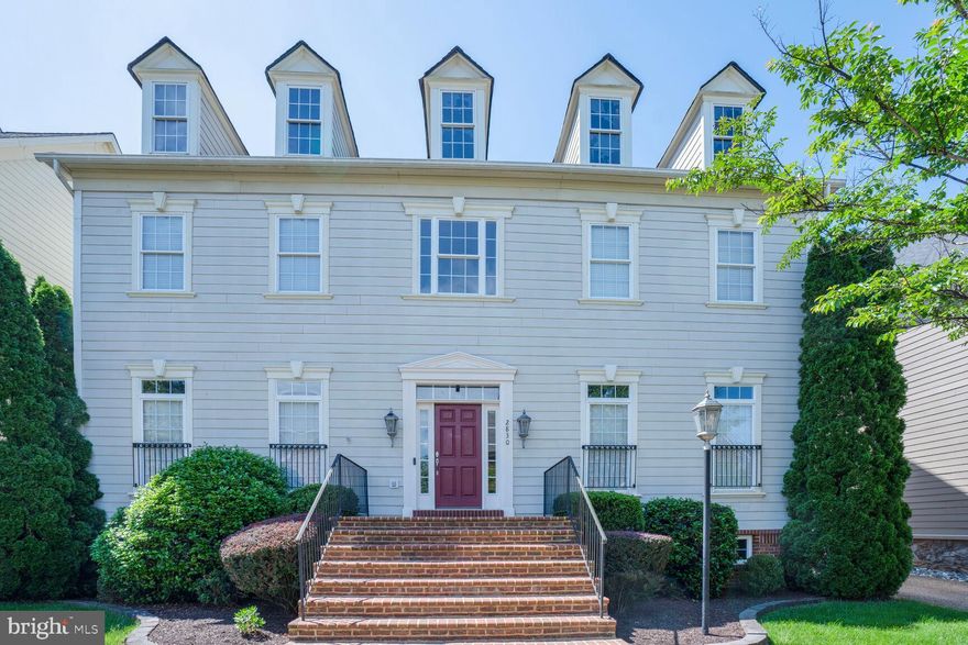 This is your unique opportunity to own a home in the highly coveted, private community of Hearthstone Village, where properties rarely become available.  This elegant STRAUSS model, the largest of the 3 models in Hearthstone Village, offers 4 beds, 4 1/2  baths across 3 levels.  Open and airy with  10' ceilings on the first floor and 9'  ceilings on upper and lower levels.  Quality built with Hardi Plank siding and brick.   
As you enter the main level, you are greeted by gleaming hardwood  floors that flow through the grand 2-story foyer, living room, formal dining room,  gourmet kitchen and office/library--ideal for work from home convenience. The gourmet kitchen is equipped with sleek stainless-steel appliances that cater to all your culinary needs.   The convenient staircase provides easy access to the Family room which features a cozy gas fireplace and coffered ceiling.    From the Family room, step out onto the deck and private brick patio--perfect for grilling and entertaining outdoors.  A unique highlight of this property is the backyard privacy; this home site sits on one of only a few lots in the neighborhood that offers such seclusion.
Upstairs, double doors lead to an oversized Master Suite with coffee bar, sitting area, dual walk-in closets and bathroom foyer with make-up counter.   The primary bathroom is generously sized and includes a large soaking tub, double vanities, and two private water closets.   A notable feature of the primary bathroom is the dual entry walk-in shower, which incorporates windows to allow natural light.   In addition to the Master Suite, the upper level accommodates three other large bedrooms, one with en suite bath and the other two flanking a Jack & Jill bath.   For practicality, the laundry room is situated on the bedroom level and is outfitted with counter space, both upper and lower cabinets and a built-in sink.                                        The charming lower-level English basement features an expansive recreation room, full bath, and two flexible use areas, perfect for adapting to your specific needs.   The 2-car garage is equipped with an EV charger.  This intimate neighborhood of just 58 homes provides a sense of exclusivity while still offering easy access to major commuter routes, including I66, Rt50, Dulles Toll Road (Rt 267), Vienna Metro, Dulles International Airport, Washington D.C. and Reagan National Airport.  Abundant shopping and dining options are just minutes away.   Fantastic opportunity to purchase a home in this rarely available location.