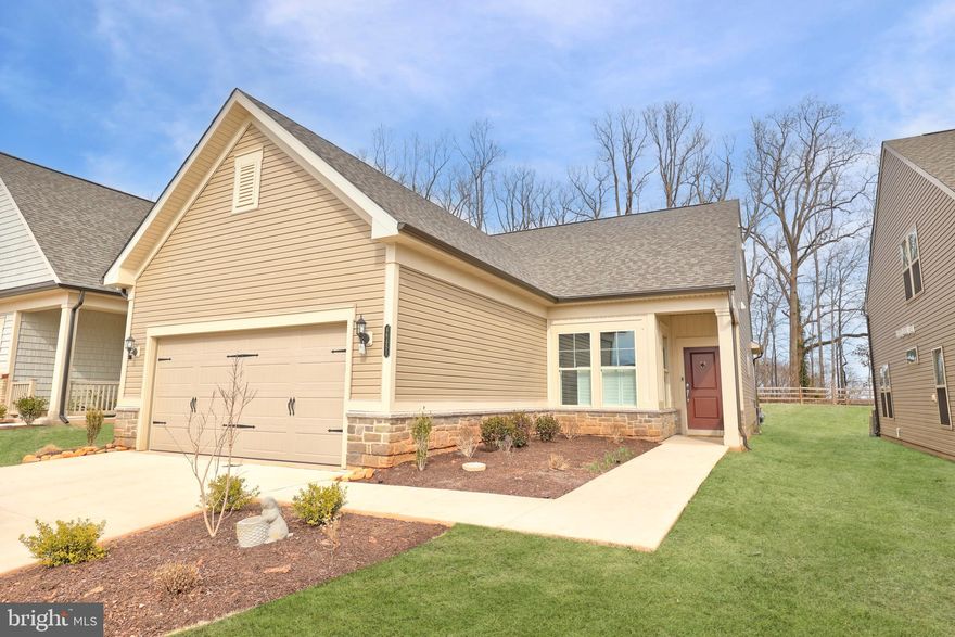 This stunning 3-bedroom, 3-bathroom home is a perfect blend of elegance and comfort, situated on a premium lot that backs to serene woods. Custom paint and gorgeous wood vinyl flooring enhance the main and lower levels, while the upper level features cozy carpeting. The bright and open kitchen boasts stainless steel appliances, recessed lighting, and a charming breakfast nook. A cozy fireplace warms the inviting living room, and the sitting room provides a peaceful view of the backyard. The primary suite impresses with a custom walk-in closet and a luxurious ensuite bath featuring a dual vanity, a standing shower, and heated flooring for ultimate comfort. Additional bedrooms offer generous space, and an enclosed flex room on the upper level provides endless possibilities. Thoughtful upgrades include a new roof, added storage in the garage, a gas fireplace, crown molding, chair rail, upgraded blinds, ceiling fans, a medicine cabinet, sliding drawer cabinets, and a custom storage system in the primary closet. The beautifully manicured front and rear yards feature hardscaping, a flagstone patio and stone wall, and a full irrigation system to keep the landscape lush and vibrant.

Located in Montebello by Del Webb, a vibrant 55+ community, residents enjoy an array of resort-style amenities, including The Guilford House, a 14,000-square-foot clubhouse, indoor and outdoor pools, a fitness studio, game rooms, a social hall, and an outdoor kitchen with a covered lounge area. Additional features include pickleball and bocce ball courts, a community garden, walking trails, a tot lot, and a full-time lifestyle director. With entrance gates, individual yard maintenance, common area upkeep, trash removal, and snow removal included, this exceptional home offers both luxury and convenience in an unbeatable setting.