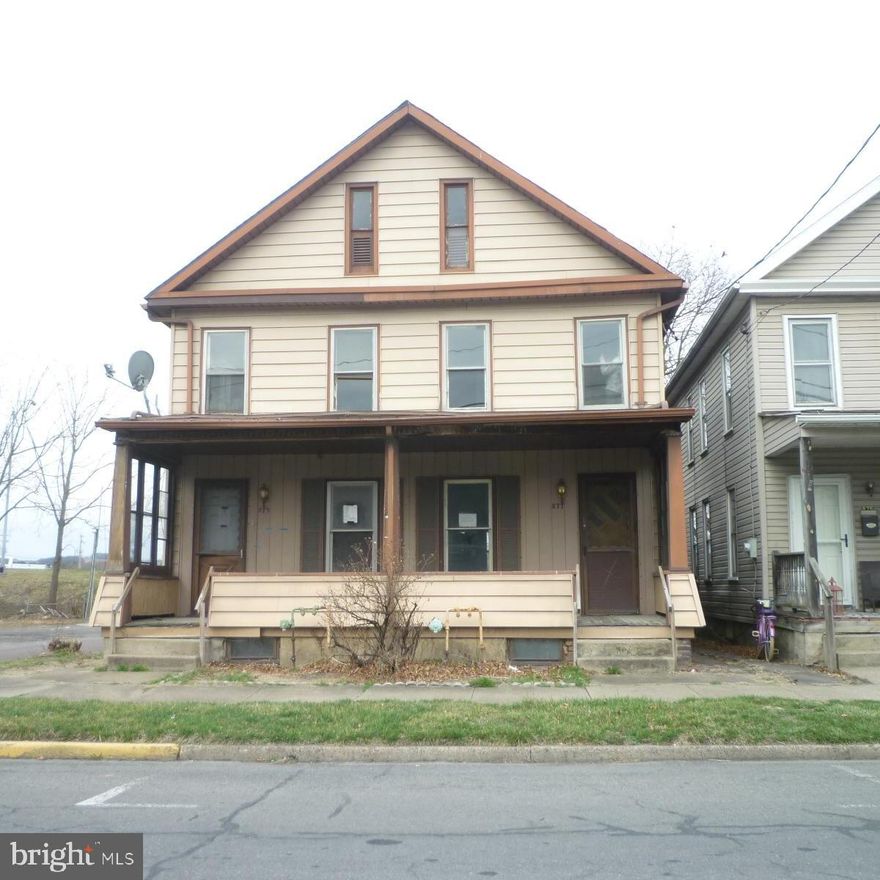 Live in one and rent out the other. Situated on a corner lot. Each side has 3 bedrooms and a full bath. Unfinished attic and basement. Level backyard. Front porch.
