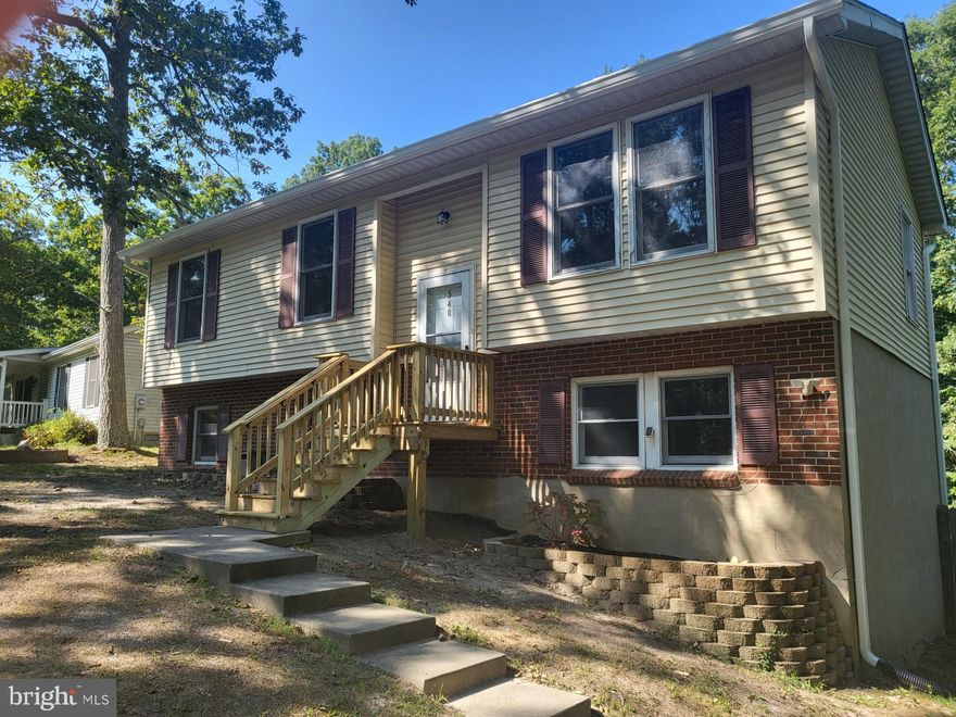 This conveniently located home has 5 Bedrooms, three on the Main Level and  lower level with a 4th & 5th Bedroom, Bath and Recreation room. THE PUBLIC RECORD IS INCORRECT......There is  a Lower Level and the Majority of it is FINISHED! It has new Kitchen cabinets, Floor, paint and other improvements......New Roof installed last year! This Split Level home is situated very close to the CRE Rousby Hall entrance, which can save you time when commuting into & out of the area. Location provides quick commute to PAX RIVER, Water access and Waterfront Restaurants are just minutes away! Don't let this one get a way..........make an Appointment now, it will not last long at this Price! NOTE: This is an AS-IS Sale!