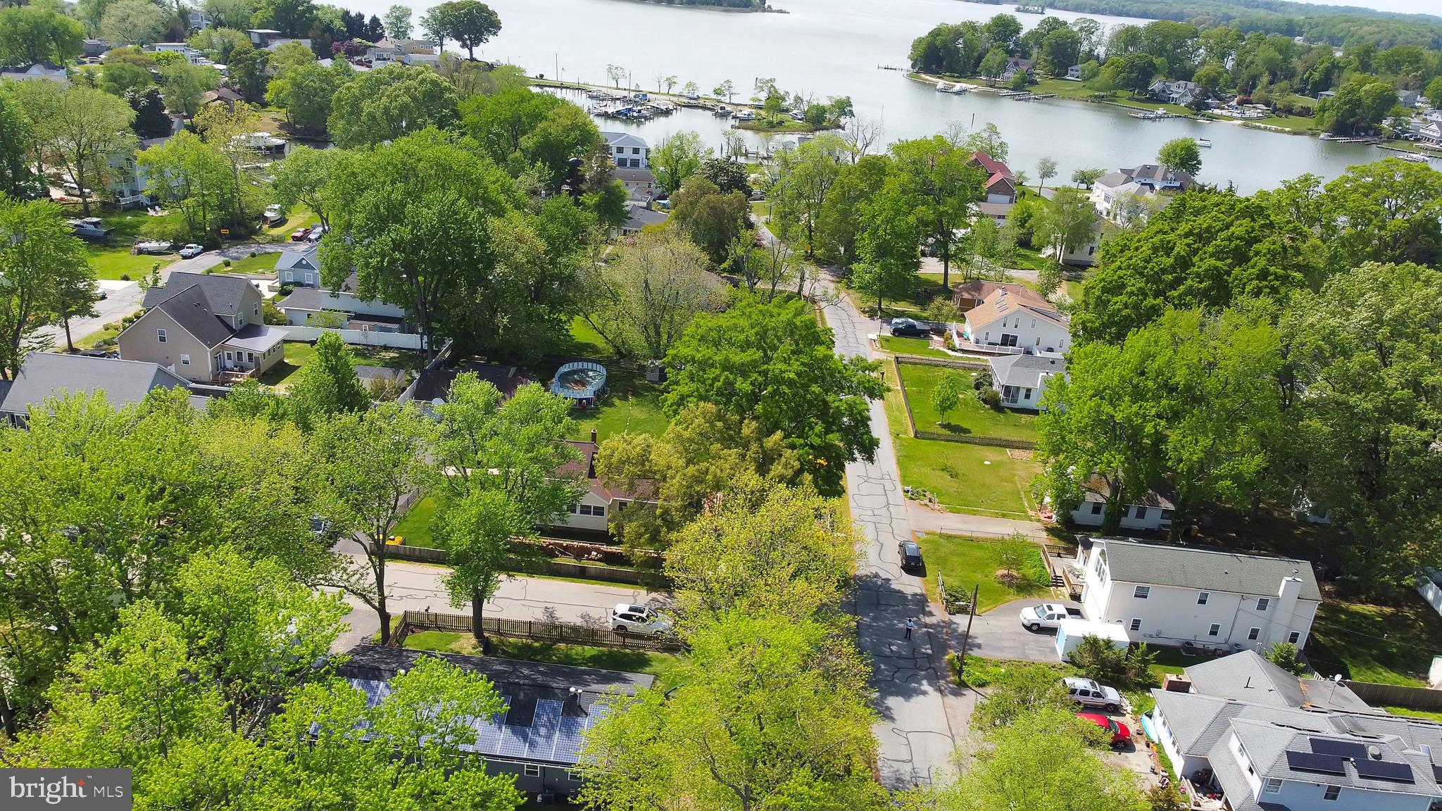 **Buyer has the opportunity to assume a loan at an attractive rate of 2.50%.** Experience coastal living at its finest in this completely renovated single-family home at 309 Lakeview Ave, just steps from the Chesapeake Bay. This one-level residence features 3 bedrooms, 2.5 baths, with the primary bathroom boasting lavishness with a separate tub and a luxurious walk-in shower. Additionally, a sunroom offers versatility and can be converted into a 4th bedroom.
The open floor plan seamlessly connects the gourmet kitchen to the living areas, while high-quality construction and durable LVP flooring ensure both style and resilience. Extensive upgrades include a new roof, HVAC system, water softener filter, and a versatile sunroom.
The property offers the convenience of solar panels with no fee, providing eco-friendly living and substantial savings on energy bills. Prospective buyers can benefit from credits on the electric bill due to these paid-off solar panels, offering an added incentive.
Furthermore, the roof comes with a 25-50 year warranty, and the private well and septic were recently cleaned in Spring 2023. The driveway accommodates up to 4 cars, and the fenced-in yard with a shed offers low-maintenance living.
Situated just blocks from the waterfront, this coastal oasis provides access to amenities such as a beach, playground, swimming area, and marina. Don't miss out on this ideal opportunity for comfortable, low-maintenance living in a prime waterfront location.