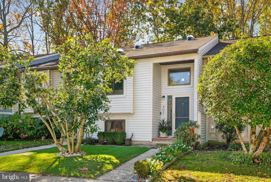 Welcome to your new home at 507 Greenblades Court in Ulmstead Gardens! This lovingly renovated 2-bedroom, 2-bathroom townhome offers 1127 square feet of warmth and charm. The freshly sodded yard hints at the special touches inside, like bamboo flooring, updated paint, and oversized Anderson windows. The stunning kitchen, with its center island, quartz counters, and stainless steel appliances, is a place to create memories. Enjoy gatherings on the spacious deck with cedar privacy partitions, overlooking serene green space and trees. The primary bedroom features two closets and an en-suite bathroom for your comfort. The spacious lower level includes a family room, second bedroom and bathroom, and a laundry room. The fully fenced backyard is perfect for pets and children to play safely. Located in the Broadneck Blue Ribbon Public Schools district, and just minutes from downtown Annapolis, with easy commutes to DC and Baltimore. Your dream home is ready to welcome you!  Upgrades Include: 2022-2025*Fresh Paint Throughout Home*Replaced all Doors and Trim*Added a Closet off of Family Room*Installed Carpet for Lower Level Family Room and Bedroom*Installed Maintenance Free Deck and Cedar Privacy Partitions
*Installed Privacy Fence for the Back Yard*Installed Patio Stones and Landscaping*Just Completed Resodding Front Yard;  2020-2022*Installed Skylights*Improved Insulation For Home*Total Kitchen Remodel to Include Cabinetry, Appliances, Counters*Anderson Windows Throughout Home