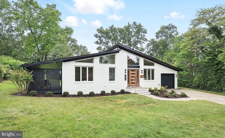 Marvelous Mid-Century in beloved Holmes Run Acres! This expanded single-level Luria model offers over 2,000 square feet of mid-century magic. Lovingly restored wood-beam cathedral ceilings retain the home's captivating character and history, while the soaring ceilings in the front addition add a glamorous twist and generous space for modern living. The stunning all-new chef's kitchen features a waterfall quartz seating island, clean, green induction cooking, drawer microwave with Advantium speed oven, custom range hood, floating shelves, pantry closet, sophisticated white-and-gold appliances, and custom LED lighting. With the center wall removed, enjoy open-concept living areas with an elegant dry bar, wood-burning fireplace (we found and refurbished the original stone hearth!), and access to the patio and spacious, newly landscaped yard. The captivating owner’s suite features vaulted ceilings, a swanky ensuite with double vanity, frameless glass shower, stylish tile work, walk-in closet, attic storage, and private access to a fantastic covered porch. A thoughtfully designed rear addition—matching the original home’s style—offers a surprisingly large recreation room, mudroom, laundry area, and direct access to the attached garage. For the practical-minded, this one offers both Form AND Function: energy-efficient Mitsubishi Hyper-Heat multi-zone mini-split system, 2" of rigid foam roof insulation, new roof, new water heater, wiring for and EV charger, and Energy Star Certified appliances.Enjoy nearby Luria Park, Holmes Run Pool, and easy access to Mosaic District, I-495, I-66, and other major commuter routes. Proudly offered by Owner/Agent.