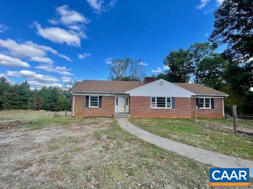 A rare opportunity in the heart of Fork Union ? TWO separate HOMES on 1.87 acres with individual water, electric, and septic systems! Ideal opportunity to create a multi-generational living setup with so much space for everyone. Property offers a quiet setting with large backyard, expansive garden spots, and multiple outbuildings including a 1-car garage /workshop, storage shed and carports. The main house offers a one level living with hardwood floors, wood burning fireplace, and spacious partially finished basement adding to the living space. Sun room faces the private back yard and is a great spot to see deer roaming around. The white cottage on property could potentially bring rental income or serve as a guest cottage. The U-shaped paved driveway adds convenience as well plenty of parking. Located in the center of Fork Union and just minutes from FUMA, this is a great opportunity to invest or settle in a quiet, small-town setting. Unlimited possibilities! Add your personal touch to make this versatile property your own!,Fireplace in Living Room