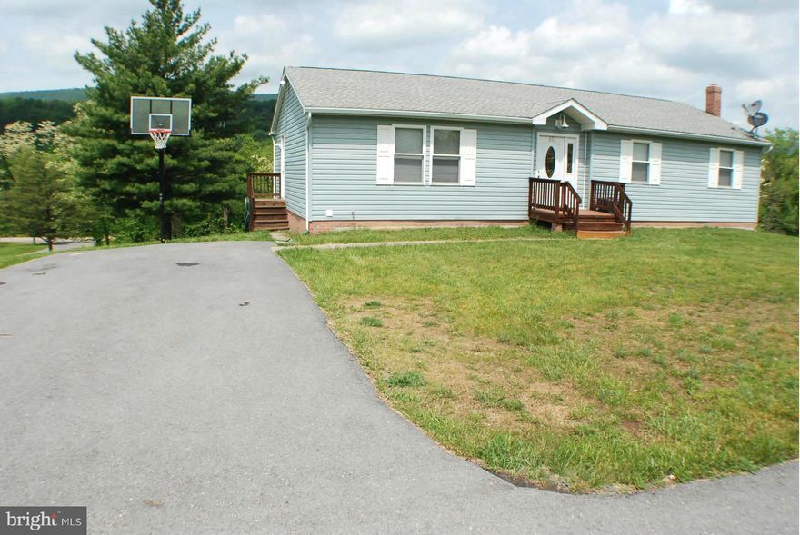 Above it all -This Rancher has Beautiful mountain views,and is in an excellent commuter location just off Rt.522,6 miles south of Berkley Springs .Plenty of living space in this 4 BR ,3 full bath rancher-with a den /office Dining area has French doors leading to the large deck to enjoy a cup of coffee and the Mt.views and wild life .