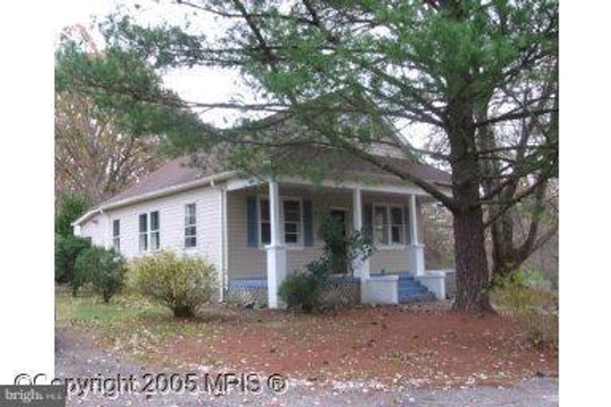 Cap Cod with great potential just waiting for the right buyer - Hardwood floors throughout the living/dinning room area. Spacious front porch with plenty of room for your favorite chair and book.  Garage has been converted to a small apartment with potential of rental income.