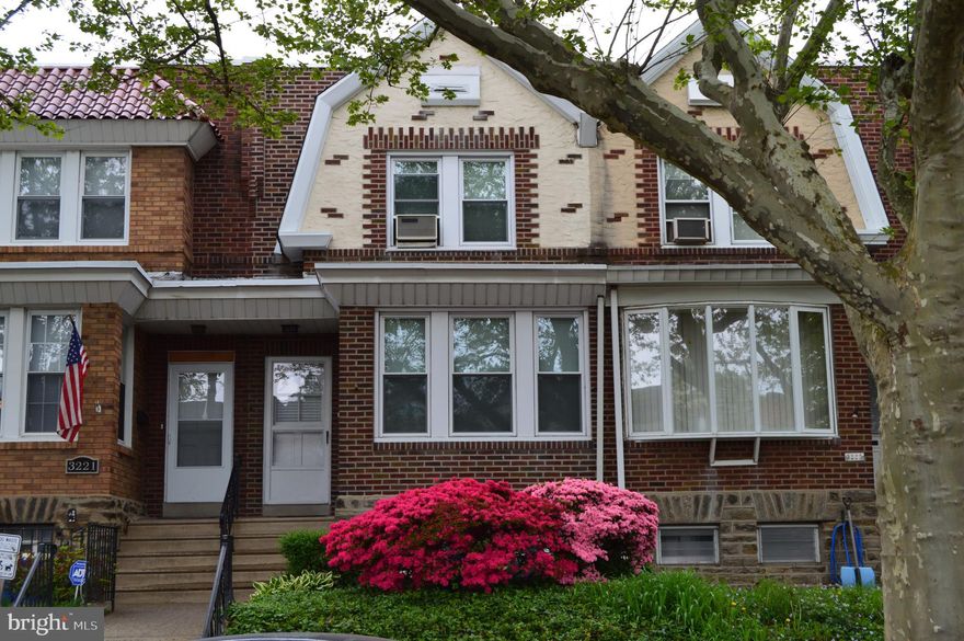 More than "great bones", this 3 bedroom 2 1/4 bath row home on a shady street in West Mayfair has been wonderfully cared for.  From newer windows throughout and stunning original hardwoods to a brand new roof with a 12 year warranty, the biggest items can be checked off the list.  This home also has much to offer in terms of ease of access to public transportation and shopping. While some may call the kitchen "dated", others might appreciate its pristine condition and retro feel paired with the custom cabinets which include deep pot drawers and sliding racks.  Seller's may or may not remove all furnishings in the house and plan to sell as is.