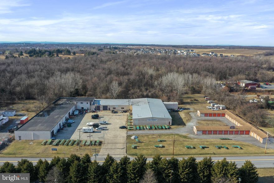 Welcome to 197 & 243 Halltown Road, Harpers Ferry, WV—a rare, multi-parcel commercial opportunity located just off Route 340 near Charles Town, WV. This expansive offering boasts nearly 40,000 square feet of versatile warehouse space, thoughtfully configured into various sizes to accommodate a range of business needs. Adding immediate revenue potential are 81 self-storage units, an in-demand asset in this growing region.

The property sits on three separate parcels, totaling 13.29(+/-) acres of contiguous commercial-zoned acreage. A vacant 10-acre parcel is ideal for expansion of the existing facility or the development of entirely new projects. This valuable zoning flexibility empowers owners to add more storage, warehouse, or light-industrial structures, or consider other lucrative commercial ventures.

Though carrying a Harpers Ferry address, this site is mere minutes from Charles Town, WV, ensuring convenient access to major thoroughfares and a steady flow of local and regional traffic along Route 340. Whether you envision a regional distribution hub, a thriving self-storage complex, or a multi-use commercial campus, this prime location makes it all possible.
Key Highlights:

· Nearly 40,000 sq. ft. of warehouse space configured in various sizes

· 81 self-storage units providing immediate income

· 10 acres of commercial-zoned land for future development

· Strategically located along Route 340 near Charles Town, WV

· Three separate parcels, offering flexibility in usage or resale

This property combines an existing, income-generating operation with additional value of the land for future development potential. Strategically located in a growing area and zoning that allows for a wide range of commercial activities, this is your chance to secure a cornerstone asset in a prime location.