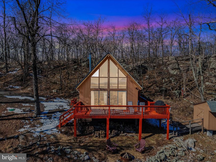 Stunning A-Frame Retreat with Endless Mountain Views!
Discover the perfect blend of modern convenience and rustic charm with this beautifully updated A-frame home at 1144 Tower Rd, Slanesville, WV. Nestled on 5.07 private acres, this home offers an unmatched, panoramic view that never stops—gaze out at multiple mountain ranges and enjoy the ultimate peaceful escape.
✨ Key Features & Upgrades:
✔ Breathtaking Views – Enjoy sweeping sights of rolling mountains from your deck
✔ Total Privacy & Serenity – Tucked away in nature for a quiet, peaceful retreat
✔ New Roof on both the house and shed
✔ New Electrical Panel for worry-free living
✔ Installed Septic System for added convenience
✔ Modernized Bathroom & New Hot Water Heater
✔ In-Unit Washer & Dryer for ease of living
✔ Electric Blinds for effortless light control
✔ Spiral Staircase – a stylish and space-saving feature
✔ Refreshed Deck & Newly Installed Driveway
✔ Comes Fully Furnished – move-in ready!
✔ Reliable Cell Service & Internet – stay connected while enjoying a secluded retreat

This turnkey get away is ready to become your private mountain escape. With stunning views, modern amenities, and complete tranquility, this A-frame is a rare gem in West Virginia’s scenic countryside.
Don’t miss out on this one-of-a-kind mountain getaway!