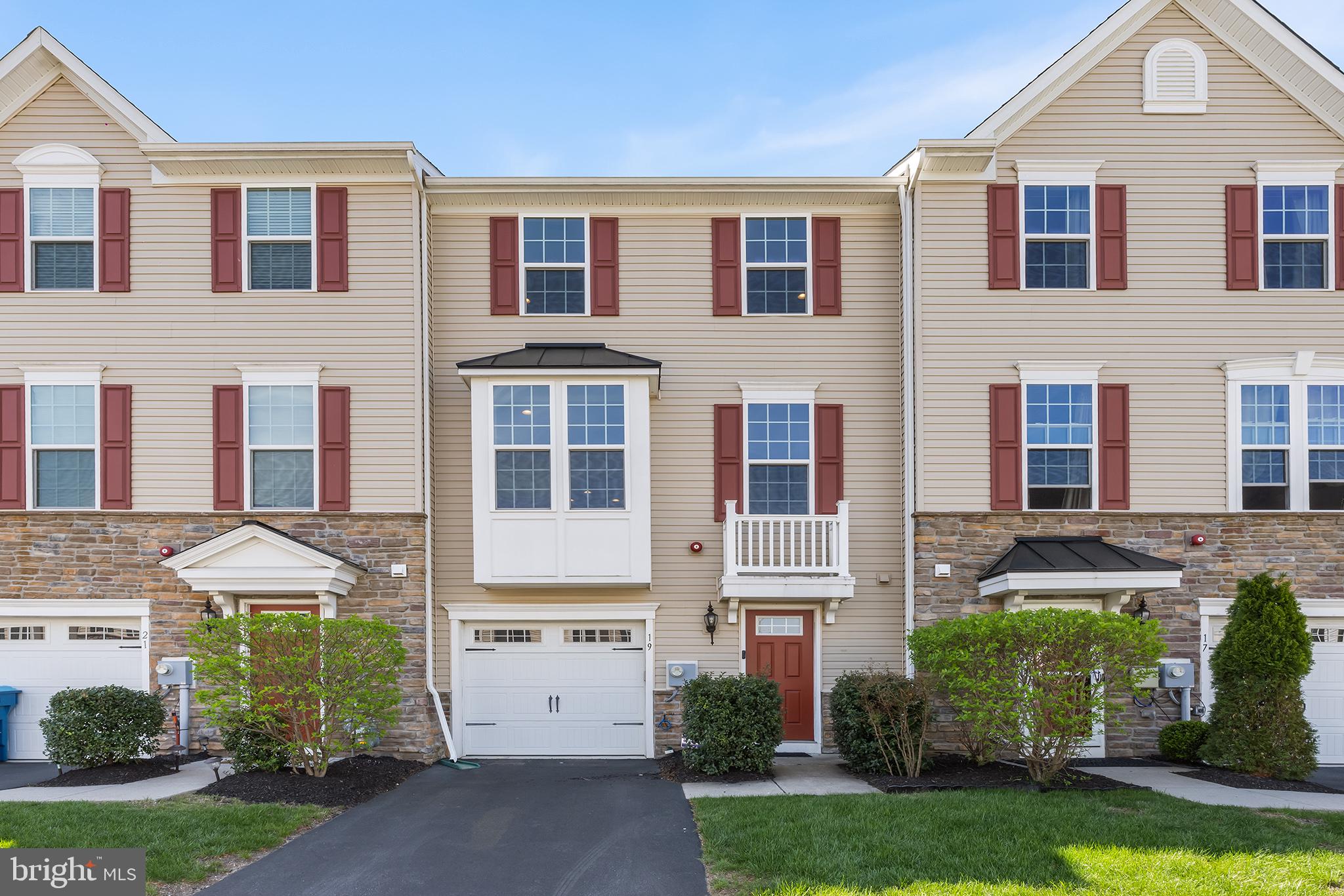 Welcome to this beautiful and modern townhome nestled in the highly desirable gated community of Wyngate. Offering three spacious levels of stylish and functional living, this home is perfect for those seeking comfort, convenience, and a touch of luxury. Enter into the lower level, where a welcoming foyer leads to a generous family room featuring a cozy fireplace and direct access to a charming brick patio—ideal for relaxing or entertaining. This level also includes a convenient half bath and access to the attached one-car garage. Upstairs, the main level boasts a stunning open-concept design highlighted by gleaming hardwood floors and abundant natural light from large windows on both sides. The expansive living room flows seamlessly into the dining area and gourmet kitchen, which serves as the heart of the home. You'll love the oversized island with seating, stainless steel appliances, breakfast bar, ample cabinetry and counterspace, a pantry, and a built-in buffet in the dining area—perfect for hosting. A door opens to a spacious second-story deck overlooking a serene, forested backdrop. On the upper level, discover three well-appointed bedrooms, including a luxurious primary suite with large windows, a tray ceiling, walk-in closet, and spa-inspired ensuite bathroom featuring a dual vanity, walk-in shower, and a jetted soaking tub. Two additional bedrooms share a full hall bathroom with a tub/shower combo. The laundry area is also conveniently located on this floor. Enjoy maintenance-free living with HOA services that include trash removal, exterior building maintenance, lawn care, snow removal, and common area upkeep. Residents also have access to a community clubhouse for gatherings and events. This move-in-ready townhome combines modern style, thoughtful layout, and resort-style amenities—all within a secure and welcoming community. Don’t miss this exceptional opportunity!