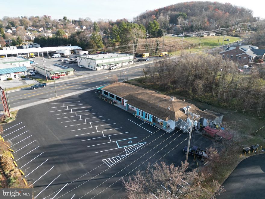 SELLER MOTIVATED to discuss creative sale or lease opportunities at this .69 acre C-1 property in prime location.  DC TOURISTS headed to Shenandoah National Park entrance (at mile 0 of the well-traveled Skyline Drive in Front Royal) & on the way to the Shenandoah River State Park MUST PASS THIS LOCATION if following GPS from DC! Adjacent to a gas station and shopping center (with Big Lots, Harbor Freight and more) near the intersection of Rt 55 and Rt 522, several large shopping centers and a plethora of businesses and food establishments.  Perfect for investors looking for a property to LAND LEASE & excellent opportunity for all sorts of businesses needing excess PARKING (60+ spaces possible). Property was remodeled and updated in 2021 and is currently home to an 18+ year popular restaurant (seller plans to retire and pursue other ventures).  As designed currently, the property offers a 38x36 banquet/meeting room with separate men’s and women’s restrooms and second bar area through double doors that could be an independent space with private entrance (plus access to rear potential outdoor seating). Main dining space measures 37x34 with a 24 ft bar area and a private men’s and women’s restrooms.   Kitchen/prep/storage/office area is huge with a rear entrance and access to  a partial basement for excess storage. Restaurant equipment is negotiable.  Seller is also offering $8k NNN lease and willing to offer creative terms. Ideal location for RETAIL, RESTAURANT, BANK, CONVENIENCE STORE, GAS STATION, OFFICE, BOUTIQUE HOTEL, FARM MARKET, VAPE STORE, DRIVE THROUGH (2 curb entrances from John Marshall Hwy) or even a much needed TESLA SUPERCHARGING STATION for those traveling on Skyline Drive. Seller will consider attractive owner financing terms w/ 40% down. Approx 4 miles from both I-66 Exit 13 & I-66 Exit 6, 11 miles from the I-66 & I-81 intersection yet under 70 miles from Washington DC and 55 miles from Washington Dulles International Airport. Easy to show! Video tours available! HIGHLIGHTS__Approx 4 miles from both I-66 Exit 13 &  Exit 6, 11 miles from the I-66 /I-81 intersection yet under 70 miles from Washington DC and 55 miles from IAD


MUST pass this location when following GPS from DC to Shenandoah River, Shenandoah River State Park, Skyline Drive Entrance, Shenandoah National Park


Fantastic signage/billboard on property! Corner lot near the first busy intersection coming into Front Royal from Northern VA! Additional Acreage may be available via boundary adjustment per adjacent landowner!


Owner willing to get creative with sale or lease negotiations and willing to finance with 40% down.


Currently home to an 18+ year proven successful restaurant business--Restaurant owner/chef is retiring and selling or leasing this property


Property could be divided--as is it offers two separate spaces (w/ sep bathrooms and bars) that are connected via double doors


Zoning
Corner lot.Heavy commercial.Adjacent to multiple shopping centers,large 7-11,KFC & large office building.Just before first major intersection in FR.