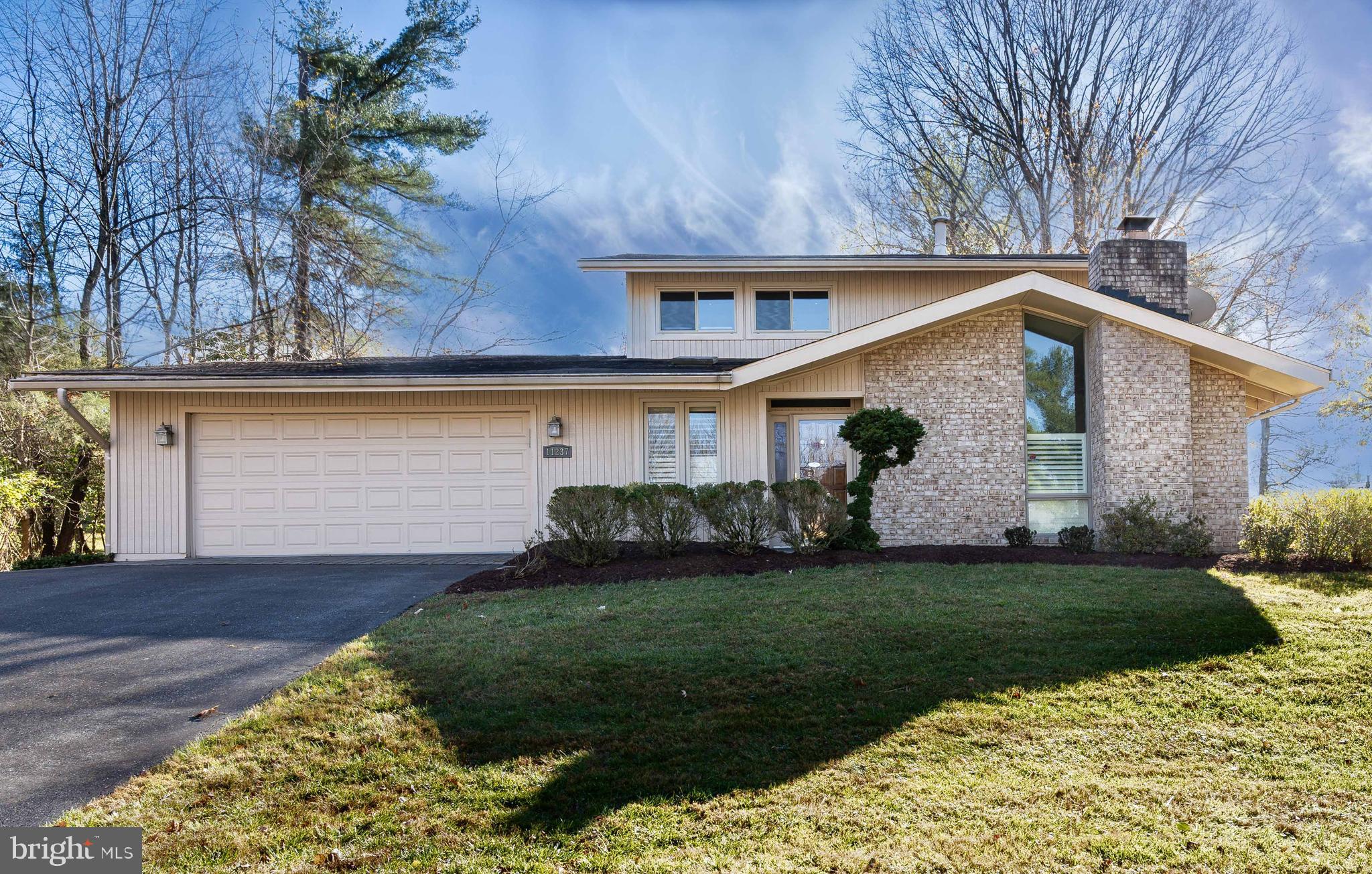 OPEN SUN 3/2, 1-3PM!!
EXCEPTIONAL BEDFORDSHIRE SHOWCASE: MULTIPLE EXPANSIONS WITH SUNROOM, PRIMARY SUITE, STUDIO & UPDATES GALORE
Welcome to this pristine 4-bedroom, 3.5-bathroom contemporary masterpiece ideally situated behind the Falls Road Golf Course and just steps from the prestigious Eldwick Swim and Tennis Club. Boasting 2,839 sq ft above grade and a total of 3,550 sq ft of finished living space, this stunning residence has undergone extensive renovations, elevating every room to its highest potential. An expansive studio addition, a two-story expansion for the primary suite and sunroom, kitchen and den extensions are just a few of the remarkable features!
Major renovations include a whole-house back-up gas generator, a newly updated primary bath and kitchen, refinished basement, luxurious marble and hardwood flooring throughout (natural marble in all baths and foyer), upgraded windows/bay windows with wood plantation shutters, and upgraded wood siding. A welcoming Foyer was transformed from a closed-up porch adding to the special features. Additional highlights include two HVAC systems (both with gas heat) and a 3rd ductless HVAC unit, driveway expansion for a 3rd car, and a brick walkway. Glass walls and skylights fill the home with natural light, offering breathtaking views from the front door through to the green backyard, which seamlessly extends to Eldwick community’s lush common area. The recessed lighting also adds to this home's ambiance.
Chefs will delight in the extended and renovated gourmet Kitchen, showcasing a charming bay window, a large granite island, custom cabinetry, and top-of-the-line stainless steel appliances, including a Thermador 5-burner gas cooktop and Dacor refrigerator. The striking glass range hood is complemented by a double sink with a water filtration system. Also note the remote-controlled blinds, a desk area, and a granite table and four matching chairs that convey.
Step down into the inviting Living Room and Sunroom addition with French door access to a private flagstone patio surrounded by tranquil parkland greenery. Just beyond a glass wall lies an expansive Studio addition, featuring skylights, custom built-ins and a separate side entrance ideal for home business. A sunlit Office with built-in shelving, a cozy Family Room with a brick gas Fireplace and accent wall with a soaring ceiling, and a beautifully renovated Powder Room round out the main level.
Upstairs, hardwood floors continue throughout. All bathrooms have been completely renovated. The luxuriously expanded Primary Suite features a private Sitting Area, arched transom windows, two (his and hers) walk-in closets, and a beautifully updated En Suite Bathroom adorned with floor-to-ceiling marble tiling, a deep soaking tub, a glass shower, dual vanities with granite countertops, and a custom-built linen closet. Three Secondary Bedrooms offer generous closet space, with two featuring bump-out bay windows and serene green views. The remodeled Hallway Bathroom boasts a granite vanity, a large glass shower with built-in shelving and a seat, plus a delightful window that invites natural light.
The Lower Level offers more space for relaxation/entertainment with a large recreation room featuring luxury vinyl flooring and built-in bookshelves, three bonus rooms, with a cedar closet in one, and a laundry room with ample storage. A spectacular Spa Bathroom with an all-glass shower and an extra lower faucet, a Silestone countertop and marble flooring adds another highlight to this already impressive space.
The oversized Garage is equipped with an abundance of storage, featuring walls lined with closed shelving units complete with sliding doors, a shoe rack, and ample space for additional organization including a huge garage Attic.
This home is close to shops/restaurants of Potomac Village, Cabin John, Park Potomac ​& Wayside ES,and easy access to 270 ​& 495