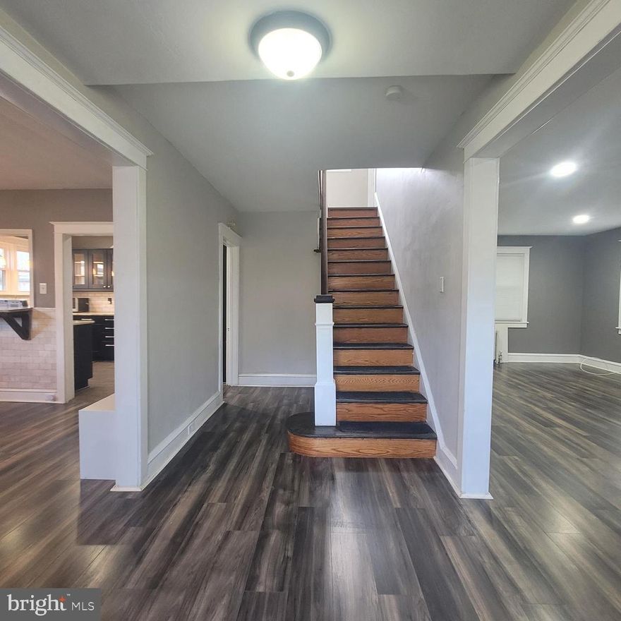 Nestled in the heart of the beloved Aronimink section of Drexel Hill, this enchanting Tudor home blends timeless charm with modern comfort. Just a leisurely stroll to top-rated elementary schools, local shops, and convenient public transportation, it offers the perfect blend of suburban serenity and city accessibility.  Step through the grand entryway and feel instantly at home. Sunlight pours through generous windows, highlighting newly installed floors and an updated kitchen designed for gathering and creating memories. Cozy up by the fireplace in the inviting living room, or unwind in the enclosed front and back porches, perfect for enjoying morning coffee or evening breezes. High 9-foot ceilings add a touch of grandeur, while a convenient half bath is tucked just off the kitchen.  Beyond the mudroom, your private backyard awaits an oasis of tranquility with an enclosed patio, a detached one car garage, and a private driveway. Upstairs, the owner’s suite offers a peaceful retreat complemented by three additional spacious bedrooms and a beautifully updated full bath. A hidden gem, the third floor attic, presents an opportunity for a fifth bedroom, den, office, guest room and entertainment room.  The basement, freshly painted with a new washer and dryer, features an additional half bath and open space ready to be transformed to suit your needs. Situated on a quiet, tree-lined street where neighbors become lifelong friends, this home is just moments from charming local dining, boutique shopping, and major routes like 1, 3, and 476. With the train station and public transportation nearby, the best of both worlds; small-town charm and city convenience is at your doorstep. Don’t miss the chance to fall in love with this Drexel Hill treasure!