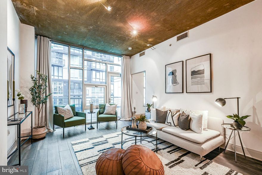 IMPROVED PRICE | Don't miss out on this amazing opportunity! 

1 bed & lofted den | 1.5 bath | 920 SQ FT | Open Floor Plan & 10 Ft High Ceilings | 97 Walk Score 

Welcome to The Floridian at 929 Florida Ave NW, in vibrant Shaw. This spacious 1 bed + den, 1.5 bath industrial condo boasts nearly 10 ft high ceilings, a modern, open floor plan, hardwood floors, floor-to-ceiling windows, and an oversized walk-in shower. Move in ready - freshly painted with Sherwin Williams paint and meticulously maintained by the owner. Entering the unit you'll find a lofted second bedroom/den with 2 closets and a half bath - perfect for guests,  a home office, or extra den space. You'll also find a hall coat closet for storage and convenient in-unit laundry with a stacked washer and dryer (new in 2021). The gourmet kitchen has stainless steel appliances, a gas range, upgraded stone countertops, and a huge pantry (a rare find in a condo).  Perfect for hosting and entertaining the kitchen island has room for 4 seats for all of your guests! Enjoy the open and spacious layout with the sun-filled living room. In the primary bedroom, you won't be short on closets - the unit has a walk-in closet with a bonus double-door closet. The en suite updated bathroom features a walk-in shower with rain head, Porcelanosa tile, and dual vanities with plenty of cabinet storage. Also a huge plus is the updated HVAC (replaced in 2023) with Nest thermostat. The building features amenities such as a concierge, 2 elevators, an underground parking garage with ASSIGNED PARKING SPACE that conveys, and a rooftop terrace with panoramic city views of the Washington Monument and the Capitol, grills, plenty of seating, and an herb garden. Located at the intersection of culture and nightlife - this is a walker’s paradise with a Walk Score of 97. Additionally - there are excellent transit options - a 5-minute walk to the U Street Metro - and biking is a breeze with the bike lanes and an 88 bike score. Conveniently located in Shaw next door to Whole Foods, there are endless options for dining out or grabbing a drink, fitness studios, or enjoying the entertainment at Landmark Cinema, The Atlantis, the 9:30 Club - you’re free to explore whatever strikes your fancy! Come experience The Floridian and see why this is the perfect place to call home!