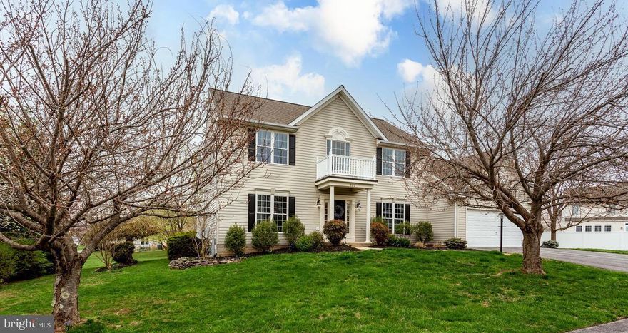 Beautiful home with 4 BR's and 3 1/2 BA's has over 3,330 sq.ft. of finished space! There is an abundance of natural light throughout with the open Foyer and lots of tall double hung/tilt-in windows. Hardwood flooring in the Foyer, Living Room and Dining Room. 9', cathedral and 2-story ceilings are accented by multi-piece crown molding and chair rail throughout. Spacious open-concept Kitchen and Breakfast Room features 42" cathedral top painted cabinets and drawers with new oil rubbed bronze hardware, granite counter tops, recessed and pendant lighting, stainless steel appliances: Frigidaire 5-burner natural gas range, Whirlpool 4-door refrigerator with double door bottom freezer, Bosch dishwasher, LG microwave, Insinkerator disposal, dine-at island with 2 deep drawers, built-in pull out trash can and granite top, plus a 5-shelf pantry closet. Expansive Family Room features LVP flooring, a cathedral ceiling, recessed lighting, ceiling fan, a wall of 6 windows overlooking the treed backyard, natural gas fireplace with a detailed wood mantle and 2 more side windows. Main floor Laundry Room with 2 double door cabinets, a separate storage closet, a laundry tub and access to the 2-car garage. The 2nd floor includes a Primary Bedroom with a cathedral ceiling, ceiling fan, large walk-in closet with an awesome built-in organizer including a 4-stack of drawers, shelving and hang bars. Beautifully upgraded/remodeled Ensuite Full Bathroom (2025) features a 5' Jacuzzi soaking tub, NEW: ceramic tile flooring, tub and separate shower ceramic tile surround, glass shower door, double bowl vanity, mirrors, commode and brushed nickel faucets and light fixtures.  Bedrooms 2-4 are all good size with ceiling fans. Also beautifully upgraded/remodeled Full Hall Bathroom (2025) includes a double vanity, medicine cabinet, NEW: quartz vanity top and sink, mirror, ceramic tile flooring, tub/shower ceramic tile surround, commode, brushed nickel faucets and light fixtures. The Basement includes: a huge L-shaped Rec Room with recessed lighting, a storage closet, Full Bathroom with ceramic tile flooring, vanity and separate shower, a separate wet bar area/room with ceramic tile flooring, sink, countertop, cabinet and a space for a mini-fridge, an areaway exit to the backyard AND a Secret Closet-a fun and unique hideaway, reading nook, castle, spaceship-a portal to imagination! The Utility/Storage Room houses the natural gas  Lennox HVAC (2022) and natural gas State Select water heater (2013). The .36ac lot is landscaped with lovely mature trees, bushes and perennials. The level backyard and patio (24' x 16') make a great place to play and entertain! The architectural shingled roof was replaced in approximately 2014. Enjoy the community tot lots, gazebo, 23+ acres of community open space along with the convenience of nearby restaurants, coffee shops, grocery stores, schools, the Eldersburg Library, Piney Run Park and more!