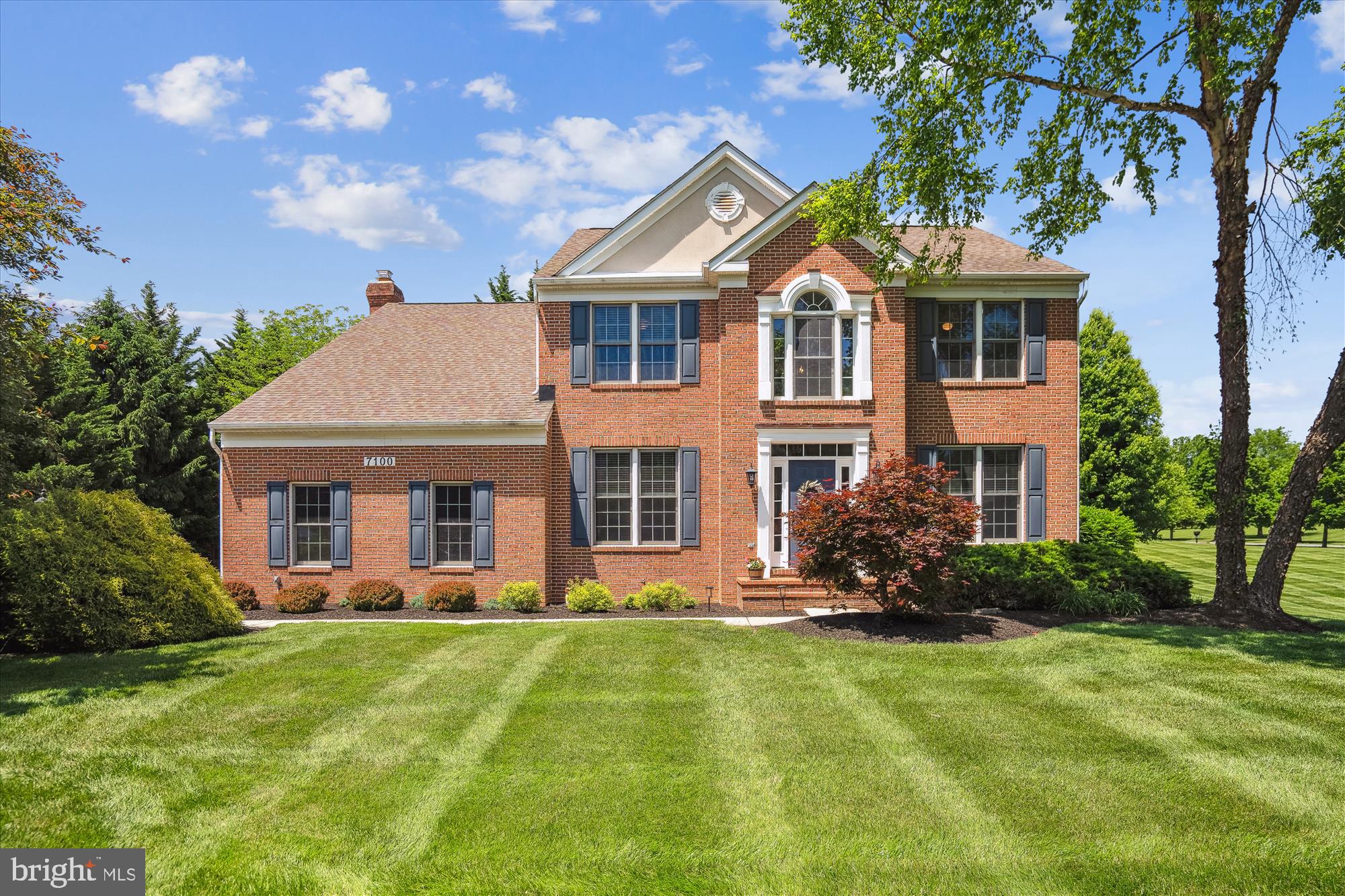 Prepare to be impressed by this truly exceptional sun-drenched 4950 sq ft brick-front colonial in the highly sought-after Ashleigh Knolls community. Lovingly maintained and stylishly updated with impeccable care by the original owners, this elegant home is move-in ready. Nestled on a tranquil non-through street, the picturesque 3/4-acre corner lot is beautifully landscaped and offers serene pastoral vista views of the backyard, side yard, and neighboring open space. 2-car side entry garage plus an expansive driveway offer ample parking for 8+ cars. The striking interior showcases a dramatic two-story foyer with a sweeping oak staircase, rich hardwood floors spanning the main and upper levels, decorative crown/chair mouldings, and generous 9' ceilings on the main level. The formal living room offers a warm gracious space for hosting festive gatherings. The formal dining room is bathed in natural light with a bay window that frames scenic views, enhancing memorable meals and lively celebrations. The main level study adorned with double french doors, offers a quiet retreat off the foyer. Relax and unwind in the expansive 4' extended family room, complete with a masonry gas fireplace that will soothe the senses and welcome you home. The remodeled gourmet kitchen is equipped with 42" white cabinets, a downdraft cooktop, double oven, sleek quartz counters, an oversized sink, and a large island for entertaining & additional seating. The extended breakfast room off the kitchen is ideal for casual dining and everyday living. The gracious upper-level primary bedroom offers a private retreat with a spacious sitting room, a luxury bath, and dual walk-in-closets. Three generously sized bedrooms complete the upper level; one with its own en-suite private bath. The sprawling fully finished basement includes an expansive recreation room, wet bar, 5th bedroom, full bath, exercise room, walk-up stairs to the rear yard, and ample storage space. Exterior highlights include a large trex deck with vinyl rails, spacious backyard, and a huge side yard with plenty of room to entertain, lounge, play, and enjoy the panoramic vista views. The rear shed offers extra storage for tools, equipment, and seasonal items. UPDATES INCLUDE: cooktop (2025), water softener (2022), complete kitchen remodel (2021), kitchen appliances (2021), water heater (2021), gas fireplace (2021), A/C condenser (2019) HVAC (2016), washer & dryer (2015), and roof (2014). Steps to community amenities including a 1-mile walking trail, and a sports court for tennis, pickleball and neighborhood parties/gatherings. BE SURE TO CLICK THE FILM REEL ICON FOR AN INTERACTIVE VIRTUAL TOUR!