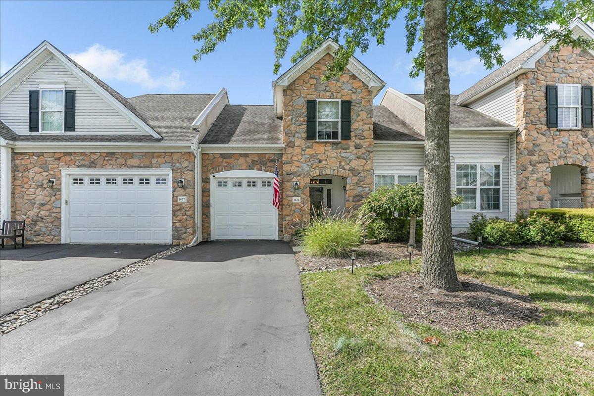 Welcome home to 1635 Dogwood Drive, an exceptional, extensively upgraded Carriage Home in the sought after Foxfield community. Featuring a beautiful stone facade that welcomes you home and walks into a lovely foyer with stone tile flooring that flows down the hallway, into a fabulous kitchen with lots of 48" cabinet space, a pantry, granite counters, stone backsplash and a sunny breakfast room. Adjacent to the kitchen is a formal dining room with crown moulding that adjoins a formal living room with a cozy gas fireplace and crown moulding that walks out to the sunny patio looking out over the backyard. The Primary Bedroom Suite has custom window treatments, upgraded lighting and two closets as well as an updated en suite bath that was recently renovated at a cost of $15,000 and is beautiful. A convenient half bath and large laundry room / mud room leads to the garage and complete the main level of this exceptional home. The upper level features an office / family room / sitting room area and there is a bedroom on this level with a large closet area. The Foxfield community offers a large club house with indoor an outdoor pools, an exercise room, billiard room, card room, library, bocci court and 9 hole gold course as well as pickle ball. Move in ready with nothing to do other than enjoy your lovely new home and all that this fantastic community has to offer.