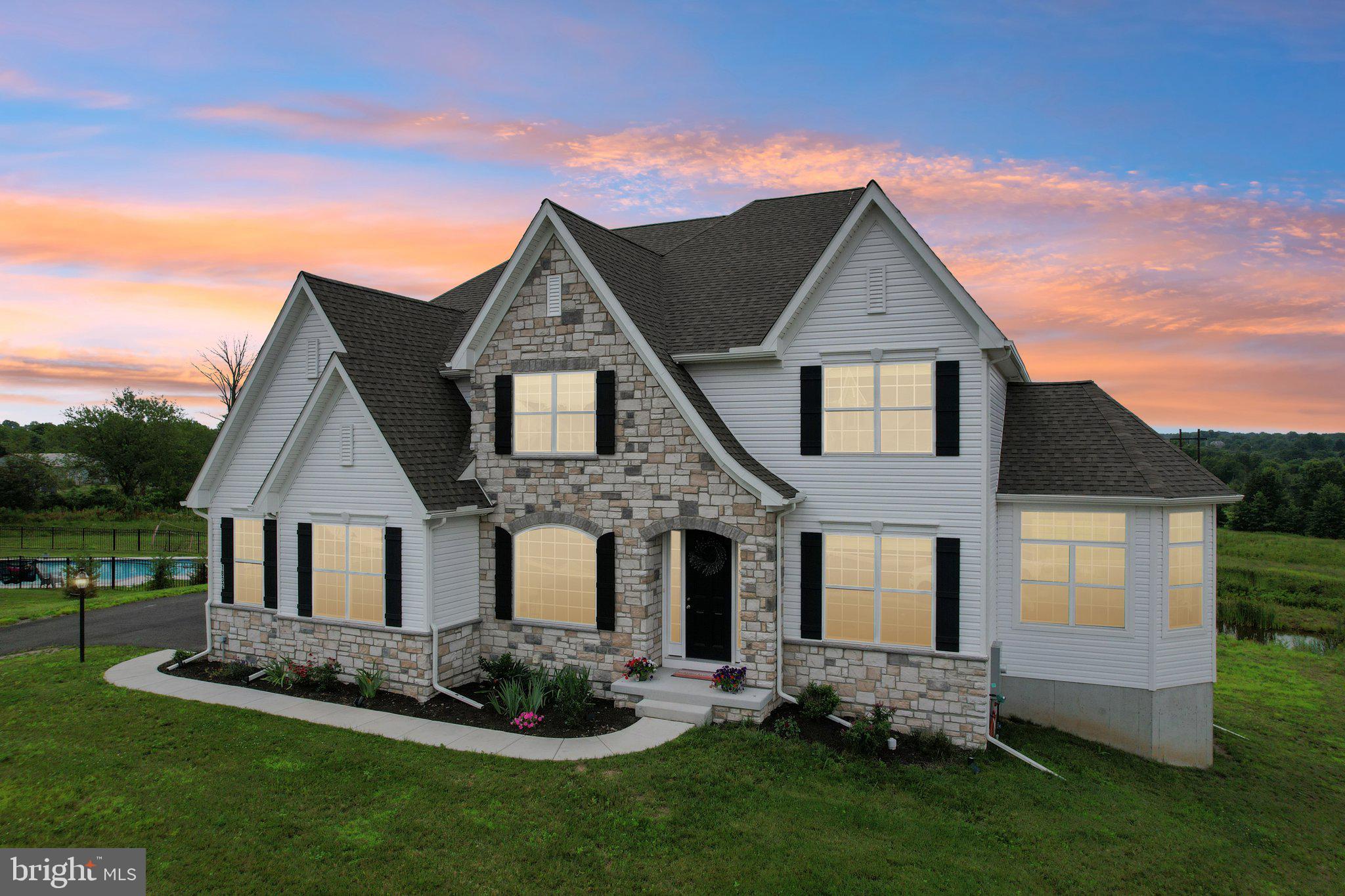 Welcome to 1832 Enclave Drive—an expansive, light-filled home in the sought-after Millstone at Parkside community. With over 5,000 square feet of beautifully finished living space, 5 bedrooms, 4.5 baths, and a 3-car garage, this property offers room to grow, relax, and entertain in style.
From the moment you step inside, you’ll notice the exceptional natural light that pours through the two-story family room and bright, open kitchen. The granite island has seating for 6 and is great for everyday use and entertaining. Whether you’re sipping coffee by the windows or hosting a lively dinner, the main living areas are always filled with sunshine and framed by peaceful views.
The thoughtfully designed layout includes a first-floor bedroom with full bath access, perfect for guests, home office needs, or added flexibility. Upstairs, the private bedroom suites offer comfortable retreats, each with generous closet space and well-appointed baths. The Master BR gives beautiful views to the rear of the home. It also has a full tile bath with standing soaking tub, tile shower, double vanity and more.
The walkout basement is a standout; finished with high ceilings, open space for recreation or media, and plenty of windows that let the light stream in. It’s rare to find a lower level that feels this inviting.
Built just one year ago, this home combines the peace of a newer build with modern finishes and smart design choices. The exterior matches the interior’s appeal, set on a picturesque lot with scenic views in every season.
Millstone at Parkside offers a serene setting while keeping you close to everything. With easy access to Routes 309, 476, St. Luke’s Hospital, and the shopping and dining options of Quakertown, you’ll appreciate how connected yet tucked away this location feels.
Elegant yet warm, spacious yet welcoming—1832 Enclave Drive is ready for its next chapter. Come experience it in person—schedule your tour today!