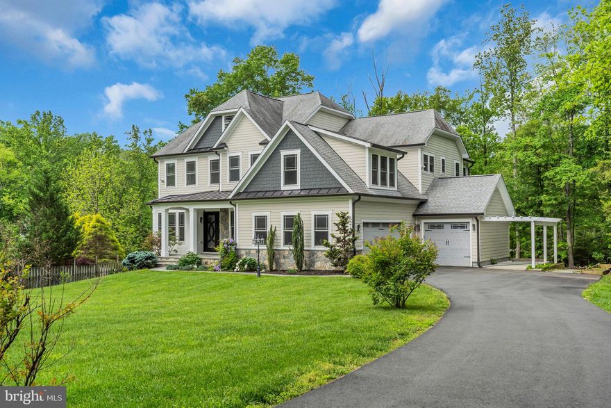 We are currently under contract, but welcome backup offers!  Grand 2017 Custom Craftsman on nearly 1 acre in Fairfax Station – Ideal for Multi-Generational Living! Discover unparalleled space and quality in this stunning, turnkey single-family residence in Fairfax Station, boasting over 7,100 sq ft of sun-drenched living. A picturesque setting with beautiful landscaping and a welcoming front porch invite you into this exceptional property. Built in 2017 with superior craftsmanship across three finished levels, this home features a remarkable 7 bedrooms (four en-suite), 6 full and 2 half bathrooms, a private den, and a 3-car garage with an EV charger. The thoughtful design and upgraded construction materials ensure both impressive scale and everyday functionality. The unique floor plan, offering en-suite bedrooms on all levels, provides exceptional flexibility and privacy for multi-generational families. Enjoy a host of luxurious upgrades, including heated bathroom floors, rich millwork, designer tile and fixtures, soaring ceilings and doors, oversized closets with organization systems, a relaxing screened porch, a sunny deck, an integrated sound system, and an essential on-demand generator. The main level features large bedroom with full bath, elegant hardwood floors, recessed lighting, and wainscoting, encompassing gracious formal living and dining rooms, a sprawling family room with a striking coffered ceiling, electric fireplace, and custom built-ins, a gourmet kitchen with high-end appliances and a massive walk-in pantry, a practical mudroom, a large island with casual dining, a stylish bar area, and a powder room. The upper level, with hardwood floors, offers large primary bedroom with salon bath and balcony, 3 additional bedrooms, 3 full baths, an en-suite above the garage, and a dedicated laundry suite. The bright and airy walk-out lower level provides a vast recreation room, an additional bedroom, a full bath, and a versatile den perfect for a home office, gym, or guest suite, along with a second laundry room. Enjoy effortless commuting from this prime location near multiple major routes, all within the highly-rated Robinson school district.  Check out this drone and walkthrough video: https://youtu.be/-HwOz77ioZM?si=-NglIVncTDiT3zGs.