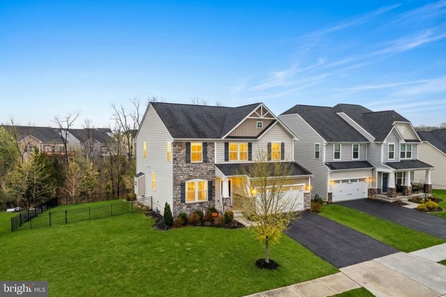 This beautifully maintained 4-bedroom 3.5-bathroom single-family home is move-in ready and situated on a premium lot that backs to trees for added privacy. Freshly painted throughout and with brand-new carpet, this home offers a clean, modern feel from the moment you step inside.

The main level offers hardwood floors throughout, a spacious office with French doors, a formal dining room, and a large family room centered around a gas fireplace. The kitchen features numerous upgrades, including granite countertops, stainless steel appliances, a gas cooktop, and a double oven. A central island provides a convenient spot for food prep, and the adjacent breakfast area includes a sliding door that leads directly to the deck. A convenient mudroom is located just off the garage entrance, and a half bath completes this level.

Upstairs, the upper level features an oversized, light-filled primary suite with two walk-in closets and an en-suite bathroom equipped with a double vanity. Three additional spacious bedrooms share a secondary bathroom with a double vanity. For added convenience, the laundry room is on this level, and all bedrooms, along with the main-level office, come equipped with ceiling fans.

The finished lower level includes a large recreation room with a full bathroom and a sliding door leading to the patio. This space is already pre-plumbed for a future wet bar, making it ideal for entertaining. You will also find an unfinished room that can be customized as a media or exercise room, as well as a very large utility room with ample space for storage.

Outside, the property features a large composite deck with a retractable awning and steps leading down to an oversized stamped concrete patio. The large fenced-in yard offers plenty of room for play or pets, and the two-car garage comes equipped with racks for additional storage. The house also features a dedicated alarm system and blinds installed on all windows for immediate privacy.

Enjoy the community's exceptional amenities, including an outdoor pool, a fitness room, and a community room for hosting events. The location provides easy access to I-66 and is just 10 minutes away from the restaurants and shopping in Stephens City and the Riverton Commons and Crooked Run Plaza shopping centers (Target, Walmart, Lowe's, Starbucks, Ledo Pizza, TGI Friday's and much more).

With its private lot and move-in-ready condition, this home is a must-see! Schedule your tour today!