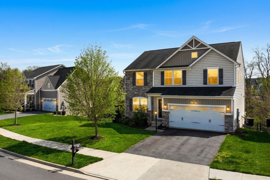 This beautifully maintained 4-bedroom 3.5-bathroom single-family home is move-in ready and situated on a premium lot that backs to trees for added privacy. Freshly painted throughout and with brand-new carpet, this home offers a clean, modern feel from the moment you step inside.

The main level offers hardwood floors throughout, a spacious office with French doors, a formal dining room, and a large family room centered around a gas fireplace. The kitchen features numerous upgrades, including granite countertops, stainless steel appliances, a gas cooktop, and a double oven. A central island provides a convenient spot for food prep, and the adjacent breakfast area includes a sliding door that leads directly to the deck. A convenient mudroom is located just off the garage entrance, and a half bath completes this level.

Upstairs, the upper level features an oversized, light-filled primary suite with two walk-in closets and an en-suite bathroom equipped with a double vanity. Three additional spacious bedrooms share a secondary bathroom with a double vanity. For added convenience, the laundry room is on this level, and all bedrooms, along with the main-level office, come equipped with ceiling fans.

The finished lower level includes a large recreation room with a full bathroom and a sliding door leading to the patio. This space is already pre-plumbed for a future wet bar, making it ideal for entertaining. You will also find an unfinished room that can be customized as a media or exercise room, as well as a very large utility room with ample space for storage.

Outside, the property features a large composite deck with a retractable awning and steps leading down to an oversized stamped concrete patio. The large fenced-in yard offers plenty of room for play or pets, and the two-car garage comes equipped with racks for additional storage. The house also features a dedicated alarm system and blinds installed on all windows for immediate privacy.

Enjoy the community's exceptional amenities, including an outdoor pool, a fitness room, and a community room for hosting events. The location provides easy access to I-66 and is just 10 minutes away from the restaurants and shopping in Stephens City and the Riverton Commons and Crooked Run Plaza shopping centers (Target, Walmart, Lowe's, Starbucks, Ledo Pizza, TGI Friday's and much more).

With its private lot and move-in-ready condition, this home is a must-see! Schedule your tour today!