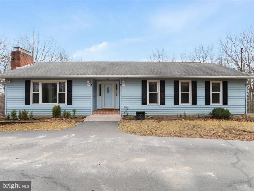 Spacious Ranch home on 5.59 Acres in Crystal Valley Estates. Surrounded by nature and abundant wildlife, this inviting property offers 2,328 square feet of thoughtfully designed living space, featuring three bedrooms and three full baths. Inside, an open floor plan seamlessly connects the main living areas, complemented by two cozy fireplaces, creating a warm and welcoming atmosphere. The well-equipped kitchen boasts modern appliances, ample counter space, and abundant cabinetry, making meal preparation effortless. Each spacious bedroom provides a peaceful retreat, while the updated bathrooms showcase contemporary fixtures and thoughtful design. Outdoor living is just as impressive, with a rear screened deck perfect for enjoying morning coffee and a patio overlooking the partially fenced yard, ideal for entertaining. The oversized two-car garage offers ample space for vehicles, tools, and additional storage. Nestled just outside Romney, West Virginia, this home offers the serenity of country living with convenient access to major destinations. Cumberland, Maryland, and Winchester, Virginia, are both less than an hour away, while the I-81 corridor is within easy reach for commuters. Washington, D.C., is a manageable two-hour drive, making this property an excellent choice for those seeking both privacy and accessibility. Located in the heart of Hampshire County, this home is surrounded by opportunities for hiking, fishing, hunting, and outdoor recreation. Despite its peaceful setting, local amenities are just a short drive away. Move-in ready and meticulously maintained, this stunning ranch home is waiting for its next owner to enjoy all it has to offer. Don’t miss your chance to experience the best of country living—schedule your private tour today