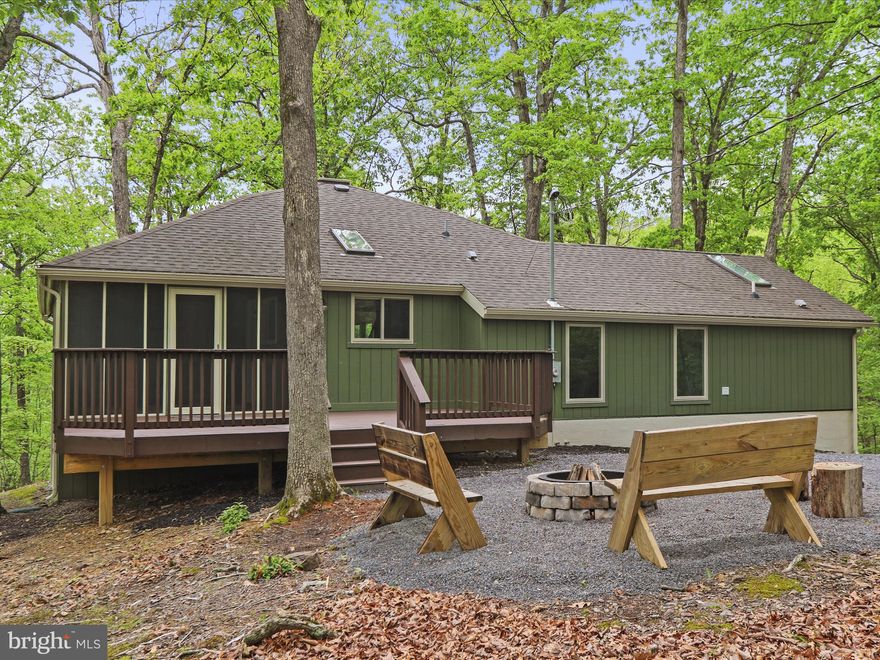 House is back on the market at no fault of the seller. 

Welcome to your move-in ready mountain escape, where modern upgrades meet timeless charm. This beautifully renovated home has undergone extensive improvements inside and out—from a freshly painted exterior and new roof to replaced decks, windows, and light fixtures, no detail has been overlooked.

Step inside to discover a bright and open layout featuring a remodeled kitchen with updated countertops, a spacious living room perfect for entertaining, and a dedicated dining area for cozy meals. Two generously sized bedrooms and two fully updated bathrooms offer comfort and convenience. The primary bath delivers a spa-like experience with its whirlpool tub and walk-in shower, while the guest bedroom boasts private access to an open-air deck via sliding glass doors—a perfect spot for quiet mornings or stargazing at night.

Unwind on the screened porch, where the surrounding natural beauty becomes part of your daily routine.

A Class A Membership to The Woods Club is available with this home—unlocking access to premier amenities including golf, indoor/outdoor pools, tennis, fitness center, clubhouse, and more.