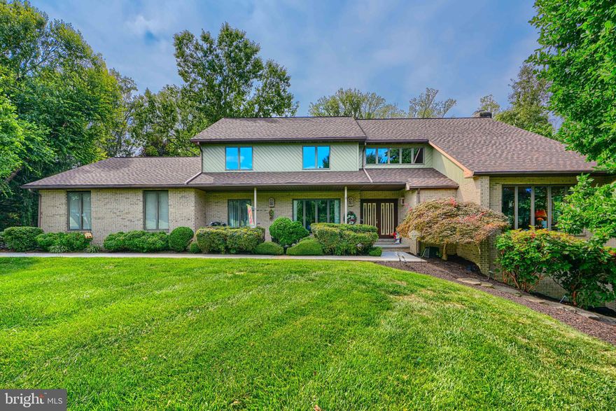 WATCH THE FULL YOUTUBE 22+ MINUTE PROPERTY TOUR WALK & TALK VIDEO FOR A TRUE VIRTUAL SHOWING WITHOUT EVER STEPPING FOOT IN THE HOME (SOME WEBSITES LIKE TO TRY TO HIDE THE VIRTUAL TOUR LINK SO LOOK EVERYWHERE FOR IT AND YOU WILL FIND IT)! WELCOME TO 128 GOUCHER WAY IN CHURCHVILLE, MARYLAND – A ONE-OF-A-KIND CUSTOM-BUILT ESTATE SITUATED ON A BEAUTIFUL AND PRIVATE 4.06-ACRE DOUBLE LOT AT THE END OF ONE OF THE AREA’S MOST DESIRABLE COMMUNITIES. THIS INCREDIBLE PROPERTY OFFERS THE RARE OPPORTUNITY FOR POTENTIAL SUBDIVISION (BUYER TO VERIFY WITH HARFORD COUNTY) AND COMBINES THE PEACE AND PRIVACY OF COUNTRY LIVING WITH THE CONVENIENCE OF NEARBY AMENITIES. FROM THE MOMENT YOU ARRIVE, YOU’LL APPRECIATE THE GRAND CURB APPEAL, PROFESSIONAL LANDSCAPING, AND TRANQUIL WOODED SETTING THAT SURROUNDS THIS HOME. FEATURES INCLUDE AN OVERSIZED THREE-CAR SIDE-LOADING GARAGE, ANDERSEN WINDOWS AND DOORS, A THREE-YEAR-NEW ARCHITECTURAL SHINGLE ROOF, A FOUR-YEAR-NEW WATER HEATER, AND A SIX-YEAR-NEW HVAC SYSTEM. INSIDE, YOU ARE GREETED BY A GRAND DOUBLE-DOOR ENTRANCE LEADING INTO AN IMPRESSIVE TWO-STORY FOYER AND AN OPEN LIVING ROOM WITH A LOFT OVERLOOK THAT FLOODS THE SPACE WITH NATURAL LIGHT. THE HOME SHOWCASES GLEAMING NATURAL HARDWOOD FLOORS, A GOURMET GRANITE KITCHEN, AND BEAUTIFUL VIEWS OF NATURE FROM NEARLY EVERY WINDOW. THE REAR OF THE HOME IS TRULY SPECTACULAR, FEATURING A TWO-TIERED DECK THAT SPANS THE ENTIRE LENGTH OF THE HOUSE WITH THREE SEPARATE ACCESS POINTS, PROVIDING THE PERFECT SPACE FOR ENTERTAINING, RELAXING, OR ENJOYING PEACEFUL EVENINGS SURROUNDED BY TREES. THE OWNER’S SUITE INCLUDES A PRIVATE BALCONY, A LUXURY BATHROOM WITH A CUSTOM SEAMLESS GLASS DOOR SHOWER, AND A DOUBLE VANITY. THE MAIN LEVEL OFFICE CAN ALSO FUNCTION AS AN ADDITIONAL BEDROOM, AND THE FULLY FINISHED BASEMENT OFFERS A RECREATION SPACE, AND WALK-OUT ACCESS TO THE YARD. ADDITIONAL HIGHLIGHTS INCLUDE A WOOD-BURNING FIREPLACE, A FULL-SIZE TRACTOR INCLUDED IN THE SALE (PERFECT FOR MOWING THE PROPERTY OR PLOWING THE DRIVEWAY IN WINTER), AND PROFESSIONAL LANDSCAPE LIGHTING THAT BEAUTIFULLY ILLUMINATES THE PROPERTY AT NIGHT. THE COMMUNITY ITSELF OFFERS A LARGE PRIVATE FISHING POND WITH GAZEBO, PICNIC TABLES, AND A TOT-LOT PLAYGROUND, MAKING IT A PERFECT BLEND OF SERENITY AND RECREATION. THIS RARE CUSTOM HOME OFFERS UNMATCHED PRIVACY, SPACE, AND CRAFTSMANSHIP IN ONE OF HARFORD COUNTY’S MOST PEACEFUL SETTINGS — TRULY AN EXCEPTIONAL OPPORTUNITY FOR THOSE SEEKING LUXURY AND TRANQUILITY IN CHURCHVILLE.