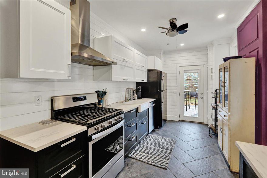 Welcome home to the charming Musser Park Neighborhood! 126 N Plum St is conveniently located across the street from Passenger Roastery & Coffee, one block from Musser Park, and quick access to all that downtown Lancaster has to offer. This home has been beautifully renovated! Walking inside the front door, you'll be greeted by a lovely living room open to the dining room, both with gleaming wood floors. The kitchen is a showstopper featuring herringbone patterned ceramic tile floors, modern white upper and black lower cabinets, stainless steel range hood over the gas stove, farmhouse sink, shiplap walls, floating shelves, and more! Off the kitchen is both a door to the side porch and a door to the back yard. The back yard has a large, new composite deck, landscaping, and new privacy wood fence. Upstairs, you'll find lots of room with a large primary bedroom, **bonus room** connecting the second bedroom and the stairs up to the third bedroom. The bathroom is off the second bedroom. This level has all freshly painted wood floors. This home has efficient natural gas radiant heat - great for keeping your energy bills low! All appliances stay with the home. Schedule your showing today - you won't want to miss this gem!