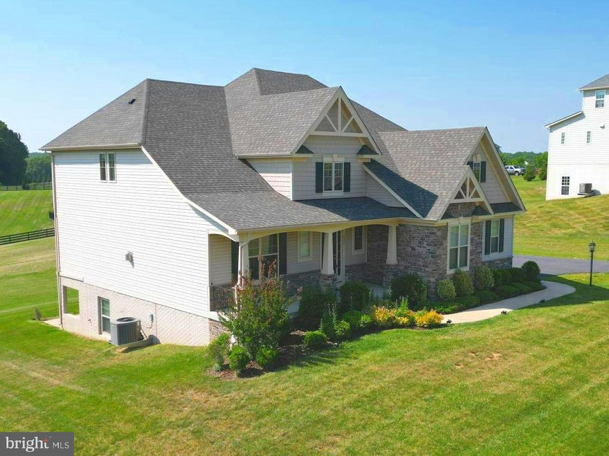 Newly remodeled and updated! This exquisite Craftsman-Style home is located on 1.31 acres in the highly sought-after Gladhill Estates, and it offers a custom living space with NO HOA! From the foyer of this freshly painted energy-efficient home, hardwood floors plus a three-centered arch leads you to an exquisite open floor plan living space. The ceilings of the entire main level offer tons of light from the ample recessed lights in the great room and beyond. Walk through the formal dining room space to the impeccable gourmet kitchen that comes complete with ALL built-in Stainless Steel appliances: a built-in double-oven, side-by-side refrigerator, microwave, dishwasher, and gas cooktop. A refreshing covered deck with dual access doors hugs the entire length of the living room. Step out onto the deck for fresh air and instantly experience the serene view of the huge, rear-fenced backyard, or choose to make s'mores on the natural gas firepit. The upper level was fully updated with brand new hardwood floors and it has 2 ensuites. The remastered and extended Master-suite has 2 walk-in closets , a spacious sitting area, and a vast backyard view. The master bathroom has two separate vanities, an amazing soaking tub, and a huge shower. Off the bathroom you'll find the large walk-in closet also with new wood flooring. The upper level has a total of 3 full bathrooms and 4 bedrooms - with one of them being an optional flex-room which gives lots of natural light from its two large windows. The basement and recreational space is fully finished and is completed by the 4th full bathroom in the home. The walkout basement has a movie theatre room with a ceiling outlet, ready for your projector and a big screen.  This room is an alternative second office space. Step out and enjoy the patio space which opens to the quiet and tranquil colossal backyard. 
Shopping centers, gas stations, restaurants, and more are just moments away. 
This home is in the Urbana High School district and close to exit 22, off of I-270.
Come see this newly updated beauty today!