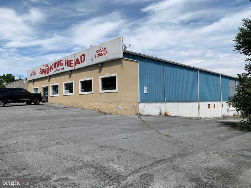 Incredible opportunity to own an amazing building and huge corner lot.  This large building is currently used as a retail space but can be warehouse, bar, office suites, and more.  This building would make a great shipping HUB as well since it has a full loading dock.  There can be more than 30 parking spaces.  There is also a full and dry basement for additional storage.  The 5 zone heat and air system has new Trane heat pumps.  The building is in excellent shape.  Long terms tenant is under lease until 5/31/2023.  List agent to accompany showings.