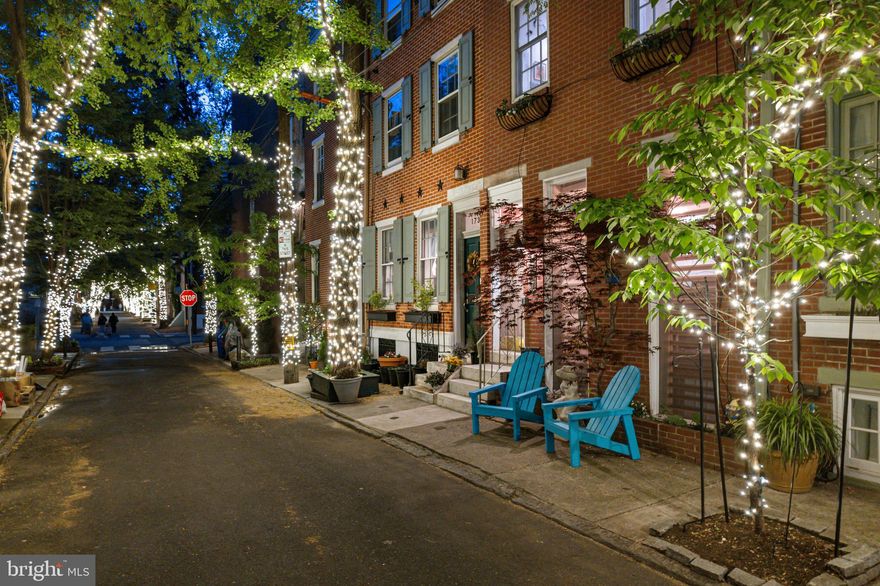 Located on “arguably the prettiest street in the entire Northeast [United States]” (Huffington Post) , 1737 Addison Street is a dream location for your future dream home. Imagine returning home to a quiet tree lined street that is lit by white holiday lights year round, and passing one of countless engagement proposals or family photos. This home is a mix of traditional character, including original 1850’s pumpkin pine flooring, exposed brick, and two wood burning fireplaces, as well as modern amenities including a brand new kitchen with Bosch 800 Series appliances with an attached brand new composite deck, brand new tankless water heater, and kitchenette! It also includes a parking spot in the rear! All of this and only two blocks from Rittenhouse Square, and surrounded by amazing restaurants.
This 3 bed 2.5 bath home has been lovingly renovated by the current owners who are a general contractor and realtor. The first floor is perfect for relaxing or entertaining guests, and features a tiled vestibule, living/entertaining space with a brand new kitchenette, walk in closet, and full bath. It’s a large parlor space that easily accommodates a 1929 Steinway grand piano (also available separately). Curved steel stairs take out past two floor to ceiling windows into the finished basement, which features a sitting room/office with one of the two wood burning fireplaces, and French pocket doors that conceal a large bedroom and half bath. Or head upstairs to the second floor, which is home to the casual living/dining area, the second fireplace, built in cabinetry, and a brand new kitchen with quartzite counters, Bosch appliances, a custom dolomite marble range hood, and a pantry/appliance garage that is way nicer than any pantry deserves to be! Go through the double french doors to the brand new second floor deck (over your private parking!) for quiet outdoor dining or drinks. The top floor includes the third bedroom, updated primary bath, new washer and dryer with a quartzite laundry area, and a large vaulted ceiling primary bedroom featuring large windows and two skylights! The south facing windows allow so much sun and look out at beautiful trees (and lights!). These homes don't come around often and always go fast!