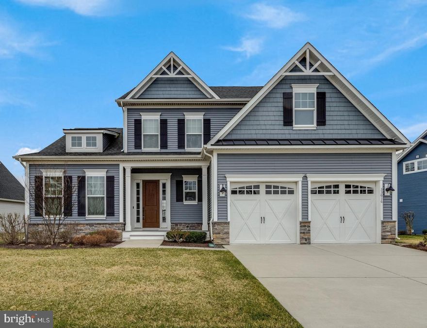 Refined Coastal Luxury in the Prestigious Coastal Club Community
Experience exceptional coastal living in this stunning Cavanaugh model, a beautifully appointed 5-bedroom, 3-bath residence built in 2020, located within the highly coveted Coastal Club community. Perfectly positioned just minutes from the Delaware beaches and within walking distance to the award-winning clubhouse, this home blends sophisticated design with resort-style living.


Upon entering, you are welcomed by a light-filled open-concept floor plan featuring elegant luxury vinyl plank flooring and expansive living spaces designed for both everyday comfort and effortless entertaining. Just off the foyer, a private guest suite with full bath offers a peaceful retreat for visiting family and friends.
At the heart of the home is a chef-inspired gourmet kitchen, showcasing Premier II Energy Star stainless steel appliances, granite countertops, gas cooking, soft-close cabinetry, a generous walk-in pantry, and an oversized island perfect for gatherings. The adjoining extended dining area features French doors opening to the covered deck, inviting you to enjoy outdoor dining and tranquil pond views.
The dramatic two-story great room is a true centerpiece, highlighted by a gas fireplace and wall of windows that frame the serene pond and wooded backdrop beyond. The covered rear porch creates a seamless transition between indoor and outdoor living while offering rare privacy within the community.
The main-level primary suite provides a luxurious sanctuary, complete with a spacious sitting area, an elegant spa-inspired bath featuring a soaking tub and separate shower, and an expansive walk-in closet.
Upstairs, an additional bedroom with a generous sitting or media room offers versatile space for guests, work, or relaxation. Two additional bedrooms and a hall bath with double vanity sinks.
The home continues to impress with a large finished basement with rough-in plumbing and egress, providing endless possibilities for additional living space, recreation, or future customization. A two-car garage with storage alcove ensures plenty of room for beach gear, bikes, and more.
Residents of Coastal Club enjoy an extraordinary collection of resort-caliber amenities set within a breathtaking 42-acre nature preserve and 5-acre pond surrounded by scenic woodlands. Community highlights include an infinity-edge outdoor pool with swim-up bar, splash pool, year-round indoor pool with lap lanes, hot tub, state-of-the-art fitness center, clubhouse lounge, on-site restaurant, tennis and pickleball courts, walking trails, and dog parks.
 Home was never rented and it was used by current owners as a vacation home for about 2 months per year. Furniture is available for purchase. Flexible rental potential, this exceptional property presents a rare opportunity to own a refined coastal retreat or an outstanding investment. Discover the pinnacle of luxury coastal living. Schedule your private tour today.