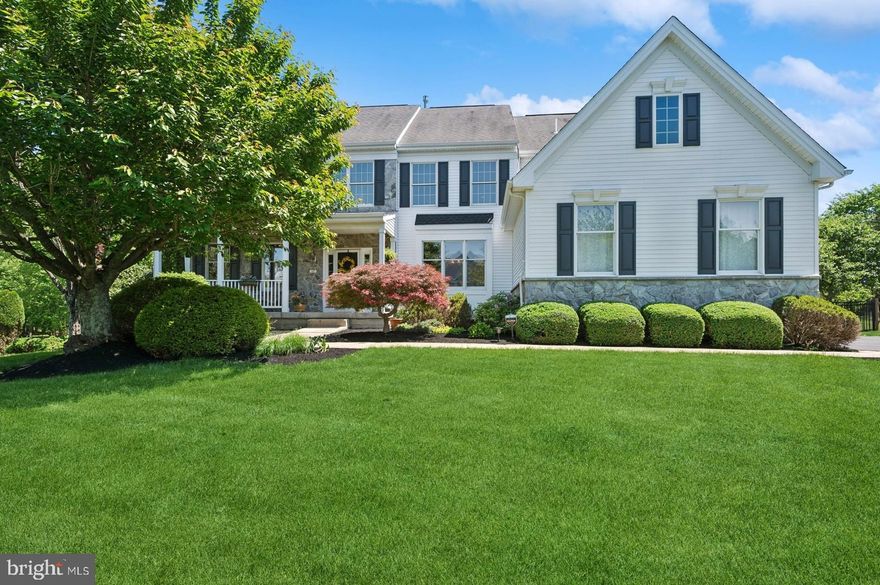 Welcome to this stunning 4,264 square foot Colonial-style residence located in the heart of Newtown Township, nestled within the highly acclaimed Blue Ribbon Council Rock School District. Perfectly situated on a cud-de-sac, this meticulously maintained home combines timeless architectural charm with high-end modern upgrades, offering a truly elevated lifestyle both inside and out. The striking curb appeal begins with a stone and white siding facade, inviting you into a grand two-story foyer with elegant wainscoting, solid oak staircase, and beautifully finished hardwood floors that flow throughout the main level—excluding a home office. To the left of the entryway, the formal living room features plush carpeting, plantation shutters, and classic French doors, providing an intimate space for relaxation, hosting guests, or as a home office. Across the hall, the formal dining room showcases designer details, including grass cloth wallpaper, a shadow box ceiling, and plantation shutters—setting the stage for memorable dinner parties and holiday celebrations. The heart of the home is the gourmet kitchen, which underwent a complete, high-end renovation in 2017. No detail was overlooked in this chef-inspired space featuring quartz countertops, a farmhouse sink, prep sink, and a pot filler above the professional-grade Thermador 6-burner gas range. The kitchen also boasts a double wall oven, Thermador side-by-side refrigerator, Thermador dishwasher, and custom-designed exhaust hood. This kitchen offers both style and function. Open to the kitchen is a dramatic two-story family room, highlighted by a gas fireplace, recessed lighting, plantation shutters, and remote-controlled blinds. This bright and inviting space is perfect for cozy evenings or large gatherings. A dedicated home office with custom built-in cabinets, ceiling fan, and French doors provides the ideal environment for remote work or study overlooking the backyard and pool. Also on the main level is a well-appointed laundry room and interior access to a spacious three-car garage, fully outfitted with built-in storage and two EV charging outlets. Upstairs, you’ll find comfort and luxury in the private quarters, accessible by two separate staircases. The expansive primary suite features a tray ceiling, sitting area, chandelier, a large walk-in closet, and rich, solid hardwood flooring, enhancing the home's clean, modern aesthetic. The primary en suite bath, completely remodeled in 2020, is a spa-like retreat with a quartz-topped double vanity, soaking tub, walk-in shower, private water closet, and wood-look tile flooring. Another full bath and three additional well-sized bedrooms complete the upper level, each offering ample closet space and natural light. The finished walk-out basement expands your living space with endless possibilities. This versatile level includes a half bath, an entertainment area, a custom solid oak bar with a wet sink, cubbies for a wine refrigerator. There’s also a spacious exercise area, ideal for a home gym setup. A secure locked room, perfect for a wine cellar or secure storage, finishes this highly functional space. Finally, step outside into your private backyard oasis. The fully fenced yard offers resort-style amenities, including a heated, in-ground saltwater pool (also separately fenced for added safety), a cabana complete with a half bath and outdoor shower, a koi pond, paver patio, fire pit area, and a two-zone outdoor entertainment system. This space is truly exceptional. Additional features include new HVAC system installed in 2020, including a new condenser and air scrubbers, a water softener, storage shed in the rear yard and numerous thoughtful upgrades throughout. This home is the perfect blend of elegance, comfort, and functionality. Don't miss your chance to own this spectacular property, just minutes from charming Newtown Borough, shopping, dining, major commuter routes, and top-rated schools.