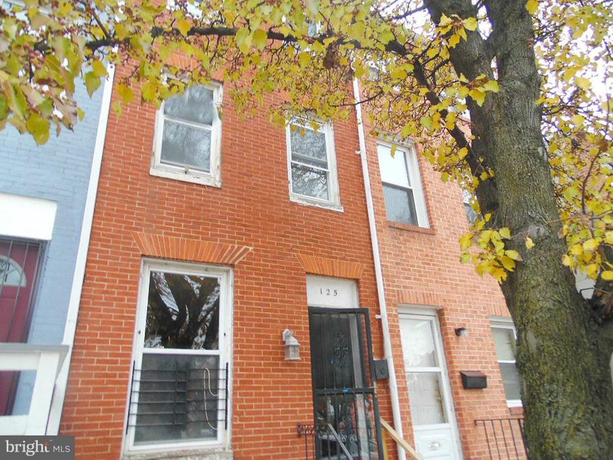 Wonderful opportunity to own this solid brick rowhome in Hollins Market neighborhood  Enjoy nice room sizes, wood floors, eat in kitchen, brick fireplace in living room. Two additional brick fireplaces are found in first upper level hallway and 2nd upper level bedroom.  The basement can be used as  added storage or finish off for additional space.  Just minutes from Downtown Baltimore!