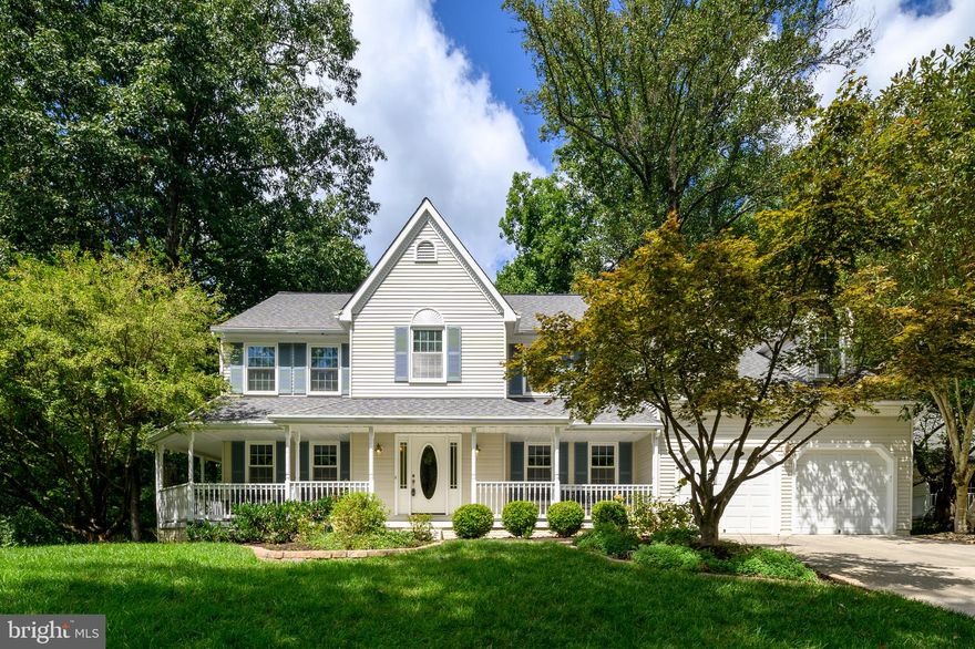 Stunning colonial located on a premium lot backing to parkland in Turf Valley Overlook.  This turn-key home is located at the end of a cul-de-sac and welcomes you with an inviting, wrap-around porch that sets the tone for a comfortable and versatile floor plan. An eat-in kitchen features on-trend white cabinetry, granite countertops and stainless steel appliances.  The family room off the kitchen boasts hardwood floors and a cozy fireplace.  The formal living and dining rooms offer hardwood flooring, decorative moldings and are a great place for entertaining.  A convenient, main level laundry room and a private half bath complete the main level.  Curved stairs lead the the upper level with four generously sized bedrooms and two upgraded bathrooms.  The primary bedroom retreat features a large sitting room, walk-in closet and a private, luxury bath with double vanity, free-standing soaking tub and a frameless shower.  Three additional bedrooms have ample closet space and share an upgraded hall bath with double sink/vanity.  The finished, walk-out lower level has a large rec room with space for relaxing, games and even an exercise area.  The office/den with a full bath close by is also a great place for guests.  Relax on the private deck overlooking the yard and parkland. This home is near all the amenities in Turf Valley including great dining, shopping, recreation and top ranked schools!