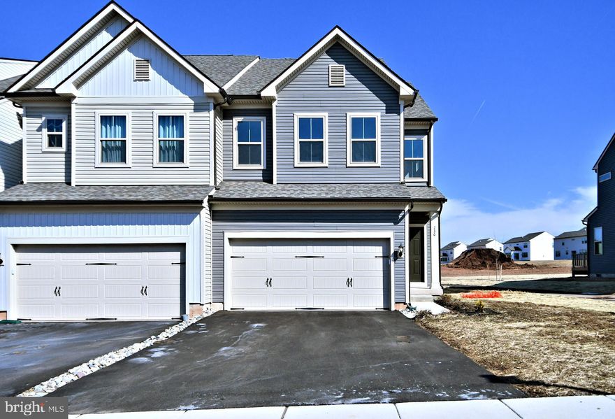 Move Right into this LIKE NEW 4 MONTH OLD END UNIT 3 BR, 2.5 BA, 2 car garage with Morning Room Resale Home in Highly Regarded Reserve at Franconia by Pulte! Upgraded END UNIT Carriage Home! Award-winning Souderton School District with walking trails connecting to Banbury-Mopec Trail and Enos Godshall Park! As you step through the main door, you will be greeted with an open floor plan with the foyer and beautiful stairs to second floor. Further down the hallway, you will be into the spacious Family Room. Adjacent to the Family Room will be the nice sized gourmet kitchen which is a chef's delight with plenty of cabinets, stainless steel appliances, upgraded granite countertops, gas cooking, double bowl stainless sink, nice sized pantry and large center island for eat-in dining option. Adjacent to the Kitchen and Family Room is the Dining Area. Upgraded option including Morning Room extension which has added about 192  square foot to the builders standard floor plan. Access the Composite Deck from the morning room for your summer gatherings. Hardwood Floor through most of first floor except Family Room. Plenty of Recessed Lighting throughout the first floor. Entry Access Area from the garage with mudroom/coat closet and powder room complete the first floor. As you head up the stairs to the second floor, the Master Bedroom is huge with walk in closets and recessed lighting. Retreat into the upgraded Master Bath including tiled floors, double vanity with granite tops, tiled standing shower and separate water closet. Two other nice sized bedrooms with recessed lights and upgraded hall bath with tiled floors, double vanity with granite tops and a soaking tub. Convenient laundry with washer dryer included in this level. Cozy loft area for a work table in the second floor. Unfinished Basement with bath rough in plumbing for your future finishing touches or for additional storage. HOA handles Exterior building maintenance including roof, siding and gutters, common lawn maintenance, snow removal from street and sidewalks and trash. Easy access to commuter routes PA Turnpike, Rt 476, Rt 309, Rt 63, Rt 463, Rt 202 and Lansdale SEPTA Train Station R5 Line to Philadelphia Downtown/Doylestown. Convenient to major employers like Merck. Minutes to Shopping, Restaurants, Gyms and Entertainment Options. Short commute to BJs, Costco, Wegmans, Walmart, ShopRite, Giant, Kohls, Lowes and Home Depot. What are you waiting for? Nothing to do but move in to this Almost New Home without the wait...