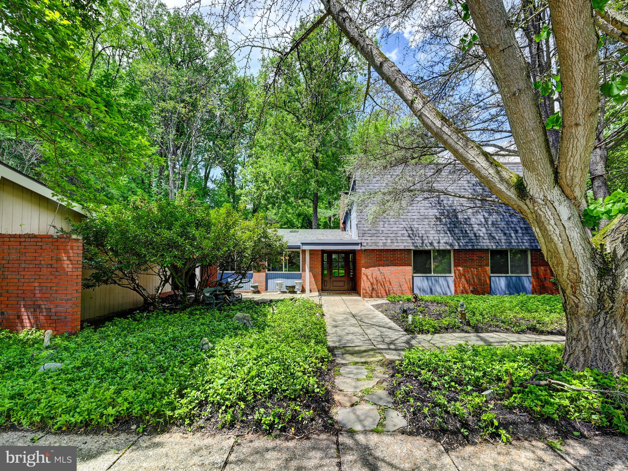 Serenely located at the very end of a quiet court and up a long private driveway, this 4 bedroom split level features on the main level : primary suite, 2nd & 3rd bedrooms, 2nd full bath, powder room, 2 dens, 2 fireplaces, and remodeled kitchen with convenient covered walkway to carport and exterior storage room. Walk right out the rear sliding doors to the covered patio and large fenced yard. The upper level boasts a 4th bedroom, full bath, big storage room and large great room. Added bonus -- enjoy your own private tennis/pickleball court! New roof.