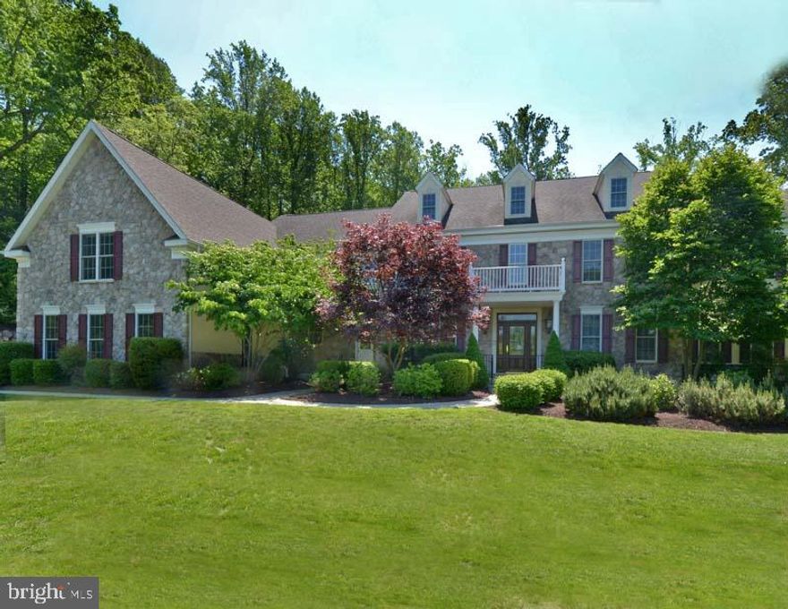 Nestled in a private enclave of 3 custom built-homes that back onto Merion CC West, this stately Estate Manor Home is exquisitely appointed throughout.  It offers a modern and spacious floor plan with exceptionally large, light-filled rooms. The 1st floor is highlighted by a 2-story Reception Hall with hardwood flooring, Home Office/Study, an oversized Family Room with fireplace & floor-to-ceiling stone surround, Gourmet Kitchen with Kraft Maid cabinetry, center island & adjacent Breakfast Room.  Spacious Living & Dining Rooms have decorative moldings, while the Sun Room has a vaulted ceiling and windows on 3 exposures.  A Bedroom Suite with Sitting Room & private bath is conveniently located in the main floor.  The spacious primary Bedroom Suite & spa-like marble Bath occupies the 2nd floor, together with 4 additional Bedrooms, 3 Baths & a Laundry Room. The finished Lower Level comprising over approximately 3,000 additional square feet which features a full Kitchen with custom granite countertop offering seating for 10, a large recreation room with fireplace, full Bath and adjacent Bonus Room.  A Mud Room with granite countertops provides inside access  to the 3 car Garage.  The location is close to shopping, restaurants, top-rated schools and all major transportation routes.