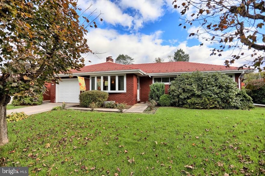 Meticulously maintained 1332 sf  3 bedroom 1 bath brick ranch on a  beautiful level .34 acre corner lot with two attached 1 car garages, a 12X24 shed, and a 24X40 detached heated garage. Large living room with a beautiful brick fireplace and a bay window, the original kitchen is in excellent condition with mid century appliances that look like new! The dining room bay window looks out over the backyard and the circular deck. A bright heated sunroom can be found off the dining room. The hall leads to a full bath with double sinks and a tub/shower combination and three roomy bedrooms. . The lower level consists of 1212 sf of finished space. See photos. All this just minutes from 322 and easy access to Rt 322, State College,& Harrisburg.