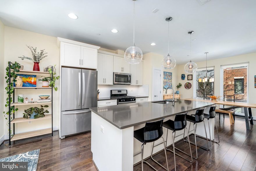 Welcome to 1525 Cuba! This stunning 4-bedroom, 3.5-bathroom ALTA47 home with a two-car garage is a rare find in the heart of Locust Point, Baltimore! With approximately 3 years remaining on its tax credit, you’ll save thousands each year—making this home even more affordable. Step inside and experience modern luxury at its finest—from the spacious, light-filled living room with fireplace, to the kitchen with a huge island, you will feel right at home as soon as you step inside. Upstairs you will find the primary bedroom suite, along with two more bedrooms, plus another full bathroom and laundry in the hallway. The fourth bedroom and third full bathroom are located on the entry level, along with a coat closet and access to your garage. Enjoy extra off-street parking spaces and visiting with your neighbors in the courtyard. But the real showstopper? Your private rooftop deck with breathtaking city views, which is perfect for morning coffee, evening cocktails, or entertaining under the stars. Located just minutes from Federal Hill, Canton, Downtown, I-95, and all that Locust Point has to offer, you will be able to take advantage of the best of city living with easy access to local shops, restaurants, and parks. Don't miss this rare opportunity to own an incredible home in one of Baltimore’s most sought-after neighborhoods! Schedule your tour today!