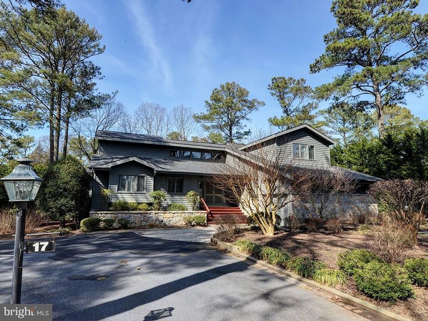 Charming waterfront home only 1 block from the ocean in the highly desired community of Henlopen Acres! Large master suite on the first floor opens up to the beautiful canal side deck with hot tub creating a wonderful indoor/outdoor space. This unique home features 5 bedrooms, 5 baths, 2 living areas, 2 fireplaces (wood-burning & gas), pine hardwood floors, vaulted ceilings, wet bar and gorgeous waterfront 3-season room. Exterior features include outdoor shower, hot tub, bulkhead, dock, beautiful landscaping & much more. Henlopen Acres includes a private beach, Beach Club, marina & Rehoboth Art League, all conveniently located within walking distance from the Rehoboth boardwalk, restaurants & shopping.