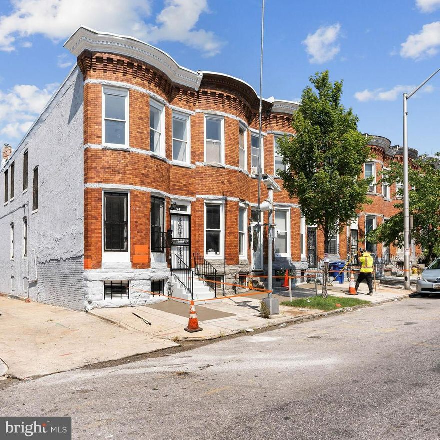 Bold brick brownstone located in the perfect location! Everything is NEW on Monroe St! Meticulously renovated in 2021 to bring you luxurious living! 9'-14' ft. high ceilings on top 2 levels and amazing floors throughout the main level! Gourmet kitchen boasts beautifully oversized counters, custom white cabinets that complement the clean lines and serve bold yet contemporary eloquence. Stainless steel appliances and elongated windows throughout make this home the unique gem you've been waiting for! Master glows with vaulted 11' ceilings and oversized closet. Spa-like bathroom radiates with natural light. Both front and rear walkouts to flexible, full basement. Spacious fully finished basement area for unlimited entertainment, beverage center and convenient utility closet with new HVAC unit.  Refreshed Deck & Patio area with private rear gated off-street parking. Don't miss this Baltimore Beauty! The entire area is being revitalized! CENTRAL HEAT AND AIR, just minutes from EVERYTHING (Baltimore Harbor, hospital, colleges, commuter buses, restaurants and shops)