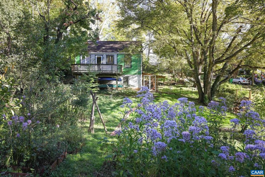 A work of art disguised as a Belmont bungalow! Looking for something unexpected? This charming bungalow, with its urban oasis of a garden on a large double lot in Charlottesville?s desirable CX-3 zoning, will appeal to artists and investors alike. Investors can explore the full potential of the Mixed-Use zoning (NO density restrictions per city) and Situs with road frontage, on Avon Street and Belmont Park. Additionally, the property borders a city ?paper street? with possible development potential. Whatever its next use, this is truly one of the most unique homes in Charlottesville! The spectacular garden, lovingly tended over the years, boasts a variety of fruit trees, heirloom plants, and flowers. And, just steps from the front door, Belmont Park offers additional open space for enjoying nature.,Fireplace in Basement,Fireplace in Kitchen