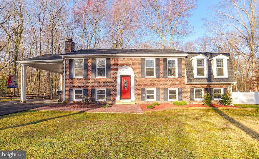 Welcome home to this 2044 SQFT 4BR split-level home  on an acre+ lot in charming Mt Carmel Estates! There are great updates like the new roof, new windows, newly repaved driveway, new skylights, refinished basement, refinished half-bath with hidden rough-in for a shower,  and new kitchen with tile floor.  Living spaces abound:  a family room and a living room upstairs and another family room downstairs with windows and access to a spacious covered patio. There are 3 BRs & 2 full baths including owners' suite  upstairs and 1 BR/ 1 ½-bath (recently updated) downstairs. Enjoy watching deer frolic on your 1.36-acre yard surrounded by the woods. Store equipment and hide clutter in the large shed. The backyard chicken coop and trampoline convey upon request.  Fenced-in dog pen area lies conveniently outside the utility room door.  There's plenty of room for badminton and gardens and there's a fire pit for burning stuff, roasting marshmallows, and toasting good times! Desirable low-traffic, end-of-street situation happening in the front yard. You will love living close to the College of Southern Maryland, Linden Farm Riding Academy, and Hawthorne Country Club. Quick and scenic access to US301, Chik-Fil-A, Starbucks, and downtown La Plata. Property to include premier coverage warranty!