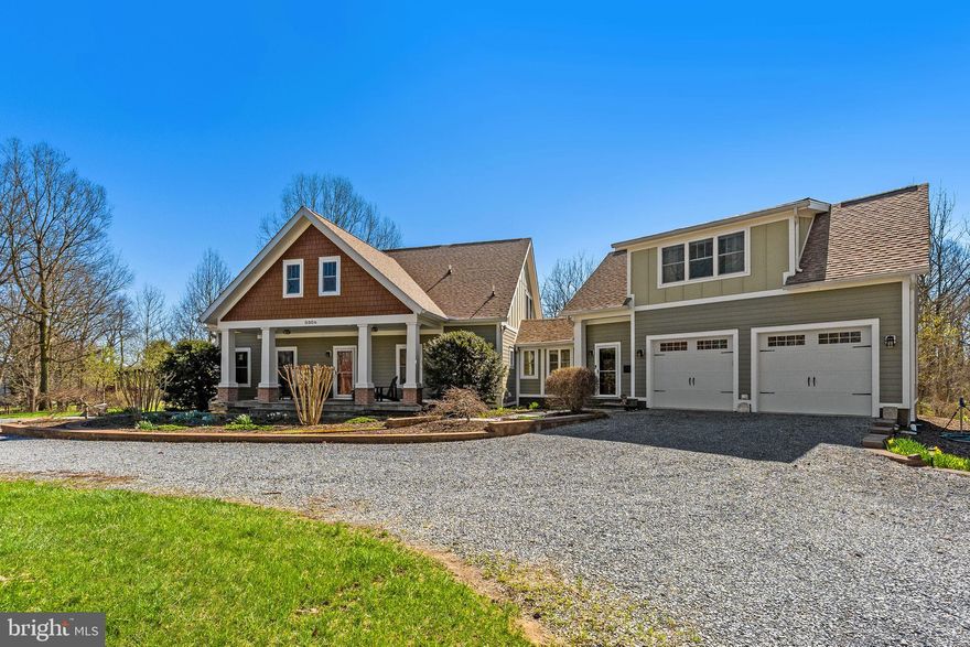 Spanning 31.84 contiguous acres across two parcels, this estate pairs a custom 2010 main residence with guest suite and 2008 three-bay barn on a 30.21-acre tract with a private two-bedroom guest cottage on the adjacent 1.63-acre lot. The primary acreage is heavily forested with established Black Walnuts, Oak, Cherry and various other species with an active planting of an additional variety of trees. This exceptional property is secured by an environmental conservation easement, ensuring its wooded grounds, historic views, and vital natural resources remain undisturbed and provide unparalleled privacy. In addition, multiple properties adjacent are also protected in various easements. For the discerning buyer, this designation offers more than just the peace of mind that comes with a protected boundary; it provides a unique financial advantage through potential estate tax benefits and preferential property tax assessments. A masterclass in eco-conscious luxury, this Shepherdstown estate sets the gold standard for sustainable living. Engineered from the ground up with Structural Insulated Panels (SIPS) providing a superior thermal envelope and a sophisticated palette of reclaimed materials, including flooring milled from the property’s own timber. This property masterfully balances architectural luxury with a pioneering environmental conscience, utilizing a rainwater harvesting system and Energy Star technology to offer a lifestyle of unrivaled efficiency and versatility. Designed for seamless indoor-outdoor living, this 4-bedroom, 3.5-bath modern craftsman flows effortlessly from the entryway through the living room and custom kitchen to a sprawling flagstone patio, pergola, and garden. Centrally positioned, a masonry heater acts as both an architectural anchor and a high-efficiency heat source, strategically bisecting the floor plan to radiate consistent warmth across both floors. Unlike a traditional fireplace, it captures heat from a single fire and slowly releases it over 12 to 24 hours to maintain a perfectly stabilized climate. An oversized two-car garage completes the estate, topped by a private 600-square-foot, one-bedroom apartment with its own kitchenette and exterior entrance. Beyond the main residence, a 24'x38' clear-span barn provides expansive utility, featuring three bays and a post-free interior ideal for heavy equipment or a workshop, plus a full second-story loft. The property also includes a separate 1.63-acre currently commercially zoned parcel featuring a versatile 1,000-square-foot carriage house used as a rental property. If used as a true guest house, the parcel would revert to agricultural zoning due to the conservation easement. While it was constructed in 1977, this secondary residence has undergone a series of comprehensive modernization, most recently in 2018, to create a sophisticated living space above a dedicated three-car garage. The interior is defined by hardwood flooring, custom cabinetry with tile accents, and built-in shelving, while the primary bath offers the high-end comfort of radiant heat. With a full bathroom on each level, a main-floor laundry, and two upper-level bedrooms, this parcel represents a turnkey income opportunity or a flexible residential retreat for family and friends. Set on a generous parcel, the home is bordered by mature hardwoods and features a network of private, sun-dappled trails that meander through the woods. The grounds offer an exceptional vision of outdoor living and environmental stewardship. For the gardening enthusiast, a substantial, deer-fenced garden plot stands ready for seasonal production, complemented by meticulously mulched perennial beds and stacked-stone retaining walls. Just beyond the property line, the vibrant spirit of Shepherdstown awaits. This historic enclave seamlessly blends its deep-rooted heritage with the energy of a thriving University town, anchored by the cultural events, parades, and seasonal celebrations.