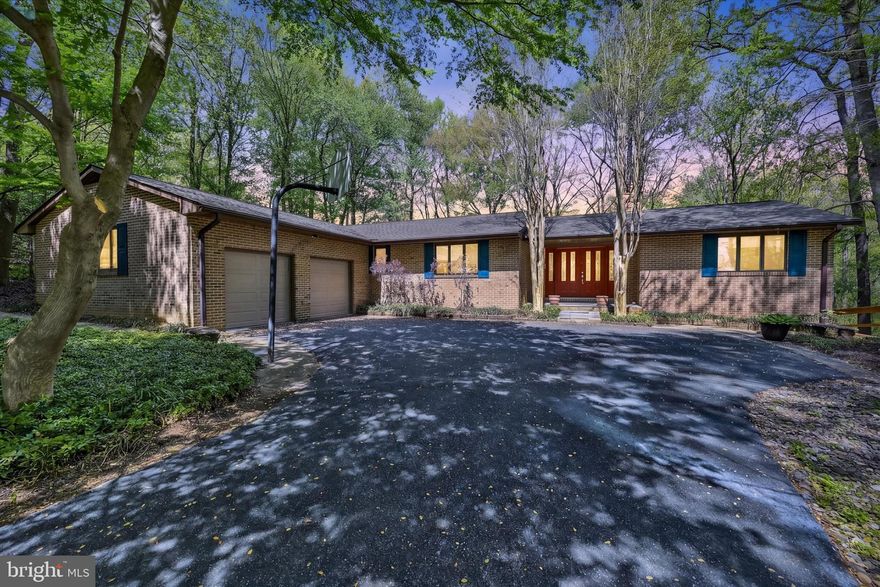 Rarely available rancher tucked away on a quiet cul-de-sac, backing to farmland and Gunpowder Falls State Park—offering a truly private, peaceful setting that feels like a retreat, yet remains close to everything.
Don’t let the exterior fool you—this home unfolds into a surprisingly spacious interior with multiple living and entertaining areas designed for both comfort and connection. The main level features an open, light-filled layout with a dedicated dining room, library/den, and inviting living spaces centered around a wood-burning fireplace.
One of the most unique features of the home is a stunning mirrored room that brings the outdoors in year-round—surrounding you with fall foliage, spring blooms, or snowfall, all from the comfort of inside.
The updated kitchen includes refaced cabinetry and granite countertops (2023), and flows seamlessly to the Trex deck—perfect for morning coffee while listening to birds, or unwinding at sunset overlooking the farm beyond.
The walkout lower level is an entertainer’s dream, complete with a full bar, pellet stove, expansive living area, and space for game nights or gatherings (shuffleboard included!) AND a workshop complete with peg board wall and  shelving!! Recent improvements include a fully renovated lower level (2024), new carpet and paint (2026), rebuilt exterior stairs and new patio (2026), and a brand new HVAC system (2025).
Set on over an acre, the outdoor experience is just as special—explore trails directly from your backyard, enjoy evenings filled with fireflies in the summer, and take in the quiet beauty of nature in every season.
Additional highlights include well and septic (recently serviced), no HOA, abundant storage, and access to highly rated schools including Kingsville Elementary.
This is more than a home—it’s a lifestyle. A place to gather, explore, and truly exhale.