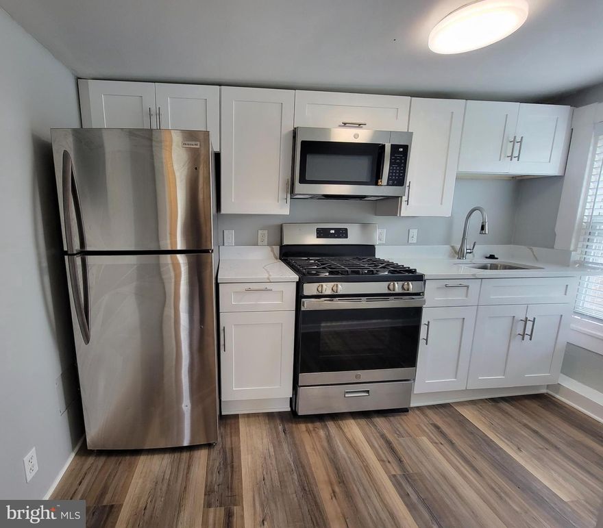 ** MODERN, RENOVATED 1-BEDROOM WITH PRIVATE DECK! **T his stylish walk-up has been thoughtfully renovated with today’s renter in mind, offering the perfect blend of comfort, convenience, and contemporary finishes. The eat-in kitchen features quartz countertops, stainless steel appliances (refrigerator, stove, built-in microwave), and new cabinetry. The spacious living room includes luxury vinyl plank flooring and an alcove ideal for a home office or study area. The bright bedroom offers large windows with custom blinds, ample closet space, and new flooring. A private rear deck provides outdoor living space with views of the neighborhood. Additional features include central air conditioning and modern finishes throughout. Conveniently located near shopping and public transportation. Schedule a tour today and experience the perfect balance of style and comfort in your next home.