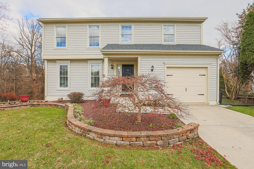 BEAUTIFUL 4 Bedroom 2.5 Bath COLONIAL located  in Britinay IV * Features Include: SPACIOUS eat in kitchen with stainless steel appliances * LARGE family room with a WOOD burning fireplace * HALF bath on main level * On the UPPER level you will find a PRIMARY suite, THREE additional bedrooms and a FULL bath * The LOWER level offers PLENTY of storage with a walk out to a HUGE manicured yard that backs to trees * BRAND new roof * Double hung closets * One car attached garage with MULTI car driveway * This WELL maintained home is located at the end of a cul de sac * Close to shops and restaurants * A MUST see!!